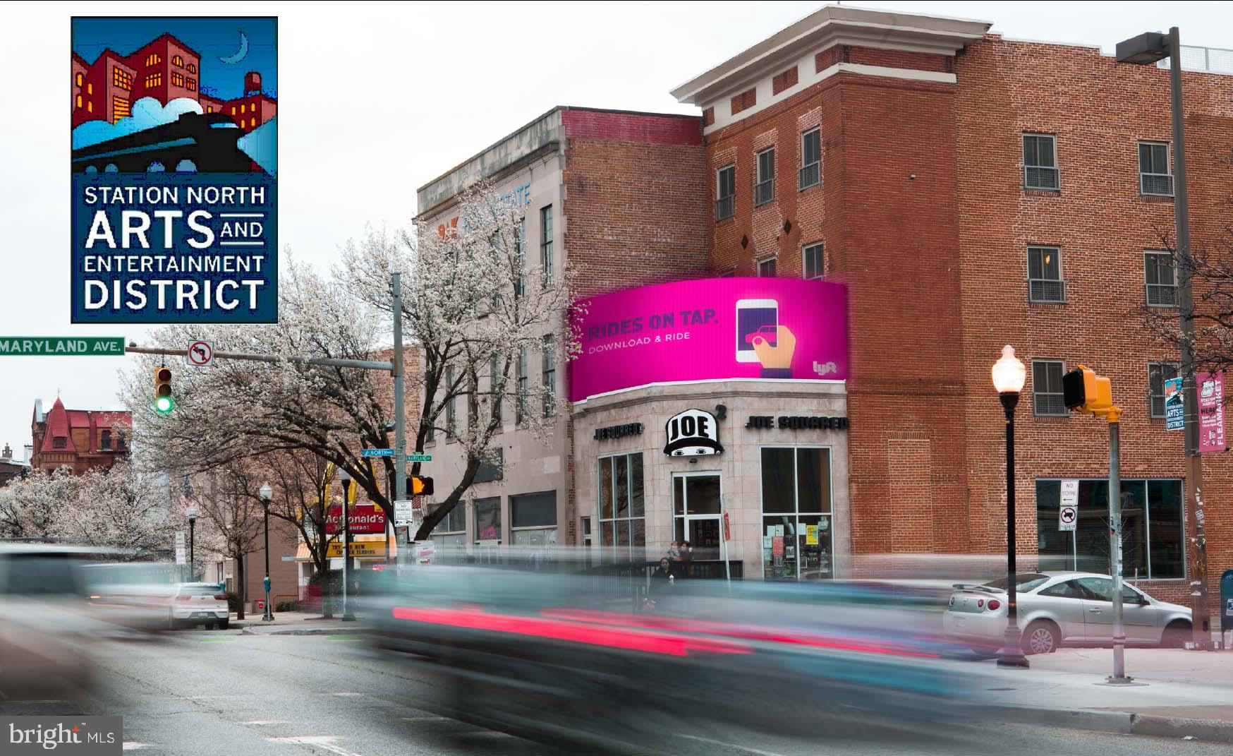 Exceptional mixed-use investment opportunity at the prominent signalized corner of North Avenue and Howard Street. Rebuilt from the ground up in 2015, this approximately 11,900-square-foot property combines a fully equipped entertainment, restaurant, and bar venue with three luxury residential apartments, creating multiple income streams within a single asset.

The commercial component encompasses approximately 5,750 square feet on two levels and features two bars, a commercial kitchen, walk-in cooler, high ceilings, oversized storefront windows, energy-efficient mechanical systems, and a separate lower-level entrance that allows for flexible operating or leasing configurations. Surface parking is located adjacent to the building, and the highly visible corner location benefits from traffic counts exceeding 31,000 vehicles per day.

The upper floors contain three expansive apartments of approximately 2,050 square feet each, including two 3-bedroom, 3-bath residences and one 2-bedroom, 2-bath residence. Residential finishes include hardwood flooring, exposed ductwork, custom cabinetry, gas cooking, stainless steel appliances, wine refrigerators, in-unit laundry, tankless water heaters, central HVAC, sound-attenuated construction, and abundant storage. Residents also enjoy access to a rooftop patio with sweeping Baltimore skyline views.

Ideally positioned near MICA, the University of Baltimore, Johns Hopkins University and Hospital campuses, Penn Station, I-83, and major downtown employment centers. Located within Baltimore's Arts & Entertainment District and near ongoing redevelopment initiatives, this turnkey mixed-use asset offers strong visibility, modern construction, and long-term investment potential.