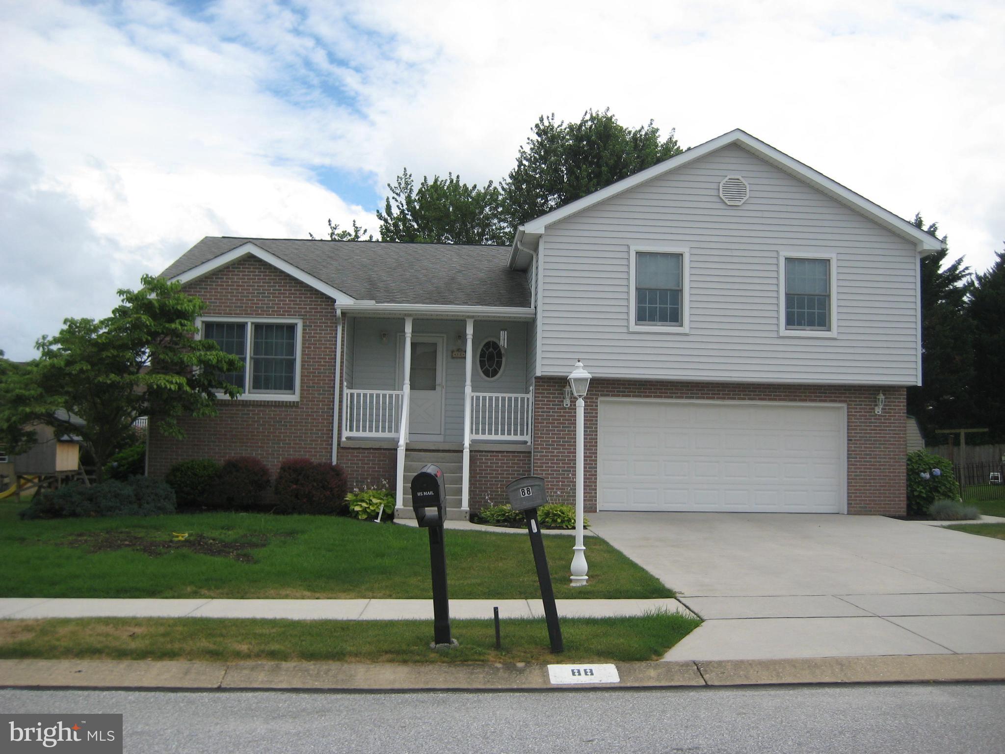 Beautifully kept one owner home in a nice neighborhood convenient to everything.  Hardwood flooring throughout. Bright living room with big bay window and built ins. Eat in kitchen with plenty of oak cabinets plus formal dining room.  Sunroom off kitchen.   Oak stairs lead up to 3 nice bedrooms with 2 full baths. Master bedroom has full bath with pocket door and walkin closet with pocket door!  2nd and 3rd bedrooms each have hardwood floors and nice closets. Hall bath has linen closet and closet for laundry.  Large, dry  basement area could be finished as well. 2 Car garage is oversized with a man door to back yard.  Composite deck with solar lighting. Great home!