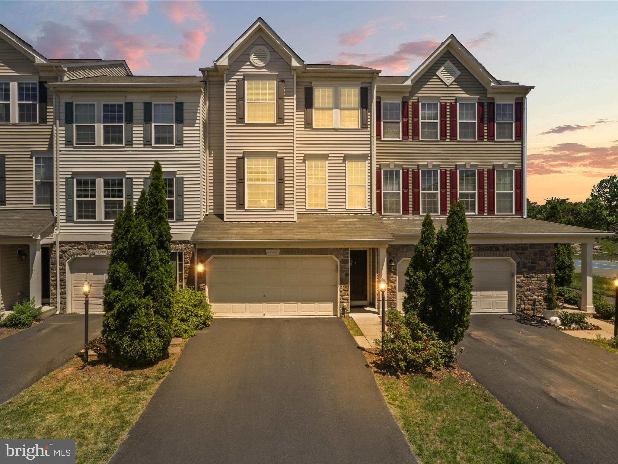 **FOR RENT**Move-in ready**Incredibly spacious and sunny 4 BR/3.5 BA townhome in idyllic Brambleton! Step into three levels of sophisticated architecture, beautiful finishes, and tranquil exterior views. Main level features fantastic open plan with sleek hardwood floors, abundant living space, and cheery window seating. Step out from sparkling & roomy gourmet kitchen onto a deck overlooking open green field space and a gazebo--envision evenings of grilling & watching sunsets with friends & family! Stairs from the deck lead down to an enclosed grassy backyard that is ready for kids, pets, or fun gardening projects. From the yard, access the lower level comprised of additional living space, full bath, and a cozy fireplace. Laundry is conveniently located on the uppermost level next to master suite. Master suite features tray ceilings, large walk-in closet, stunning views of the gazebo, and a master bath with a separate double vanity. Laundry room is on Upper level **Rare main level room is perfect for work for home office or an in-lawsuit**Fully Fenced Back Yard overlooks open spaces and trees, giving you a wonderful park-like setting to enjoy year-round *Fully finished walkout basement with large rec room which is perfect for entertaining and a full bath. *Fully finished oversized 2 car garage, extra storage racks & upgraded garage doors ,Extra Long driveway** With plenty of unreserved parking spots** Community amenities include Stratford Landing Pool and Splash Park which is just around the corner as well as several other pools, community centers, club rooms, spas, you name it! If that isn't enough **Rent Includes access to all Brambleton amenities and Verizon FIOS Package- Cable and Internet **Enjoy Outstanding Brambleton Amenities with Movie Theater, Restaurants, Shopping, Fitness Center and State-Of-The-Art Library across the Street *Premier Brambleton School Pyramid Creighton corner (Elementary School),Middle (Brambleton) and HS (Independence).Take advantage of all of the Brambleton amenities: Parks and recreation, 5 pool complex, sport courts/fields, library, adult and youth programs. Famed Hal and Bernie Hanson Park, Brambleton Town Center is minutes away: Dining, movies, coffee, groceries, doctors ,Gas station. Brambleton has 18 miles of paved trails, Tennis Courts w/ Lights, Sand Volleyball, annual events, art and farmers markets. Enjoy the lifestyle so close to home. EXCELLENT Commuter Location: Easy Access onto the Dulles Greenway & Toll Rd, Routes: 50, 15, 7, 28 W/5 miles of the Ashburn Silver Line Metro Within 9 miles of Dulles International Airport and more .