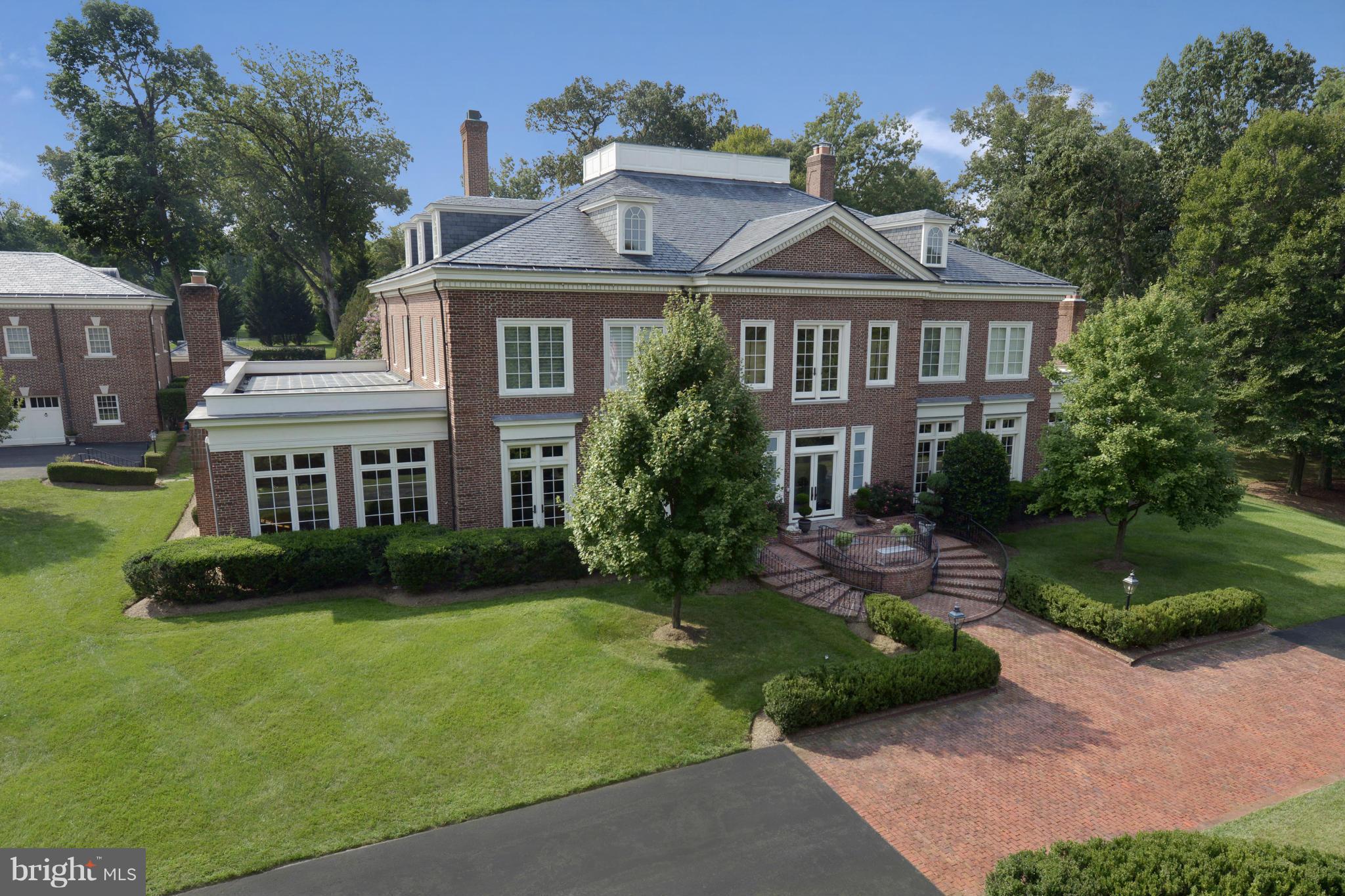 Potomac Falls' finest offering. Meticulously renovated Georgian Colonial of hand made brick, inlaid hardwood floors, plaster moldings, imported fireplaces, sumptuous baths and a sublime chef's kitchen. No detail has been overlooked and no expense spared. Four lush, glorious acres surround a large pool & pool house, tennis court, 2BR/2FB guest house.