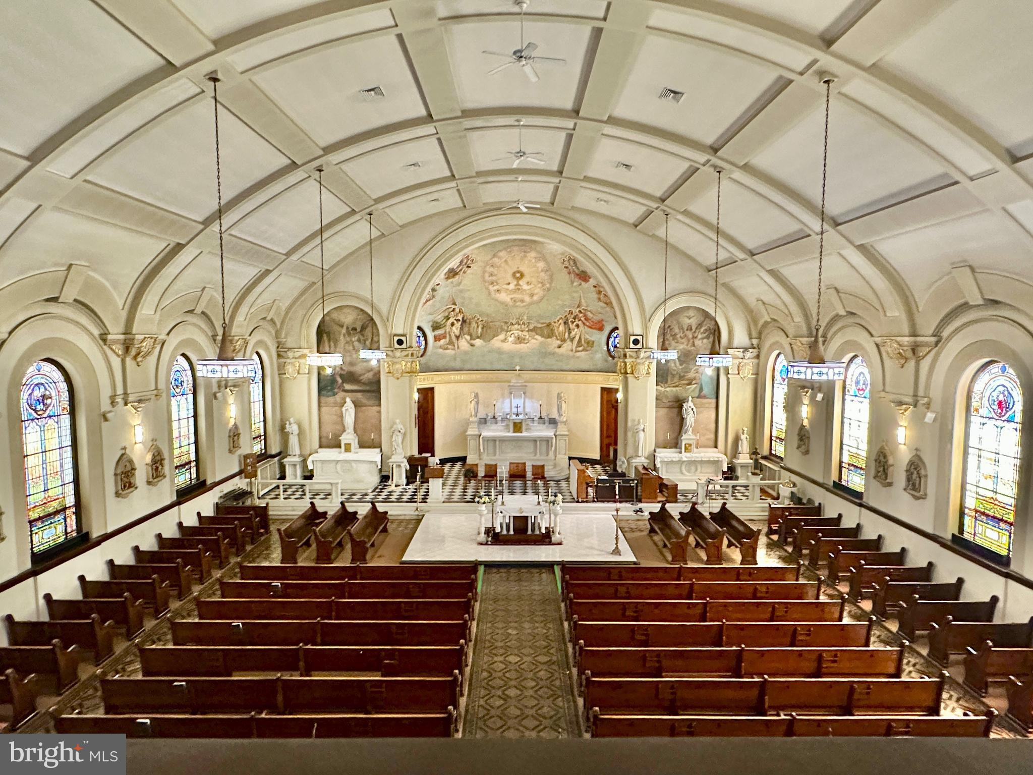 The ground-floor sanctuary includes a spacious entry foyer (narthex), a sanctuary for approximately 400 (plus a balcony), a sacristy/office, and storage.  The lower level includes a large hall, kitchen, and multipurpose spaces that could be used for classrooms, offices, and meeting spaces.   The seller will remove certain religious items, and some chattels will remain.  Sold as is.  The seller has its own LOI, contract, and closing agent.  Buyer should compensate its own broker. Please note that housing facility and parking next to the church are not part of the sale.  To schedule a tour, please register and provide proof of financial wherewithal.  Public open house:  Sat, July 18, 2-3:30p.