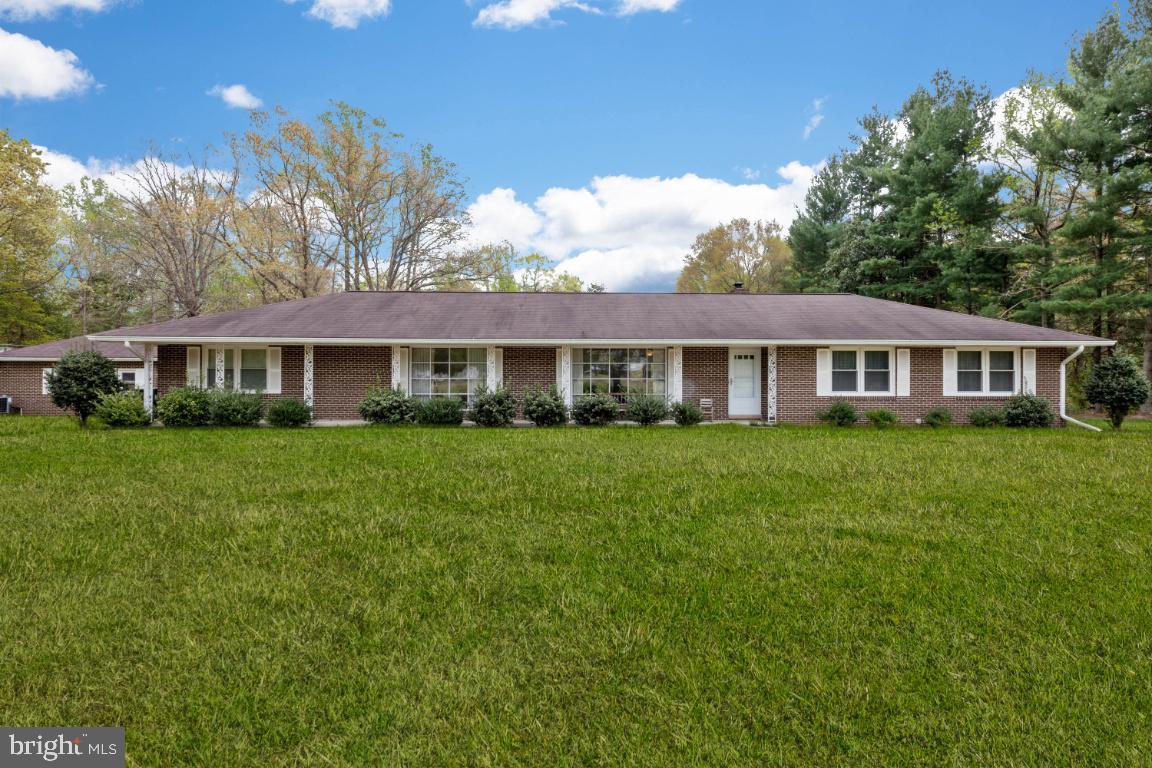 ONLY ONCE IN A WHILE DOES A PROPERTY THIS AWESOME COME ON THE MARKET FOR SUCH A GREAT PRICE*ALL BRICK RAMBLER JUST SHY OF 2,000 FINISHED SQUARE FEET*SITS ON AN OPEN AND TREE LINED 4.61 ACRES SITTING OFF THE ROAD FOR PRIVACY*SO MUCH HAS JUST BEEN REPLACED OR UPDATED IT S ALMOST LIKE NEW*OVERSIZE 1 CAR ATTACHED BRICK GARAGE*2 CAR DETACHED BRICK GARAGE*AMAZING 3 YEAR OLD METAL BUILDING *32 FEET WIDE, 52 FEET LONG AND 14 FEET HIGH*OVERHEAD GANTRY AND ELECTRIC HOIST IS PART OF THE BUILDING AND WILL REMAIN.  PORTABLE AUTO LIFT DOES NOT CONVEY BUT IS AVAILABLE FOR PURCHASE*THIS PROPERTY LENDS ITSELF TO SO MANY HOBBYISTS AND BUSINESS OWNERS*