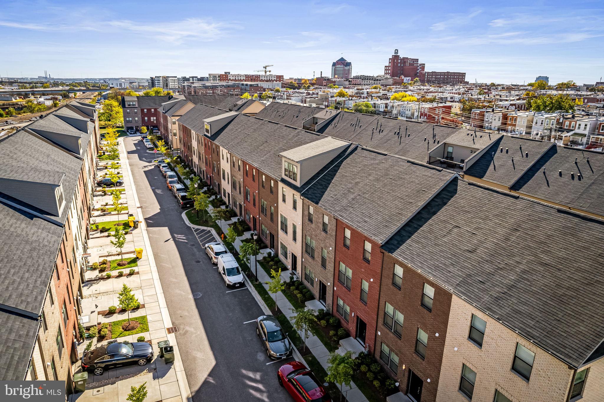 $20,000 IN INCENTIVES — BUY WITH LITTLE TO NO MONEY OUT OF POCKET! Welcome to 614 Mozart Way, a nearly new, beautifully designed 3-level townhome built by Lennar Homes in the highly sought-after Refinery Row community of Brewers Hill, offering 2 bedrooms, 2 full baths, 2 half baths, and a 2-car garage—paired with a compelling $20K incentive package that includes 100% financing with NO mortgage insurance (MIP) and NO HOA dues for the first 12 months when using the preferred lender and title company. Inside, enjoy wide-plank flooring, open-concept living, and designer LED lighting throughout, along with a private rear deck perfect for everyday living and entertaining. The modern chef’s kitchen features shaker cabinetry, granite countertops, stainless steel appliances, and an oversized island that anchors the main living space. Spacious bedrooms include large walk-in closets, while the primary suite offers a double vanity, granite counters, and tile flooring. Ideally located just minutes from I-95 and I-895 with walkable access to Starbucks, Volo Sports courts, shops, restaurants, parks, and Johns Hopkins, this home delivers both convenience and lifestyle. Enjoy added peace of mind with approximately six years remaining on the builder’s structural warranty, plus eligibility for the Johns Hopkins Live Near Your Work $5,000 grant and additional potential incentives. Sample photos and virtual staging shown.