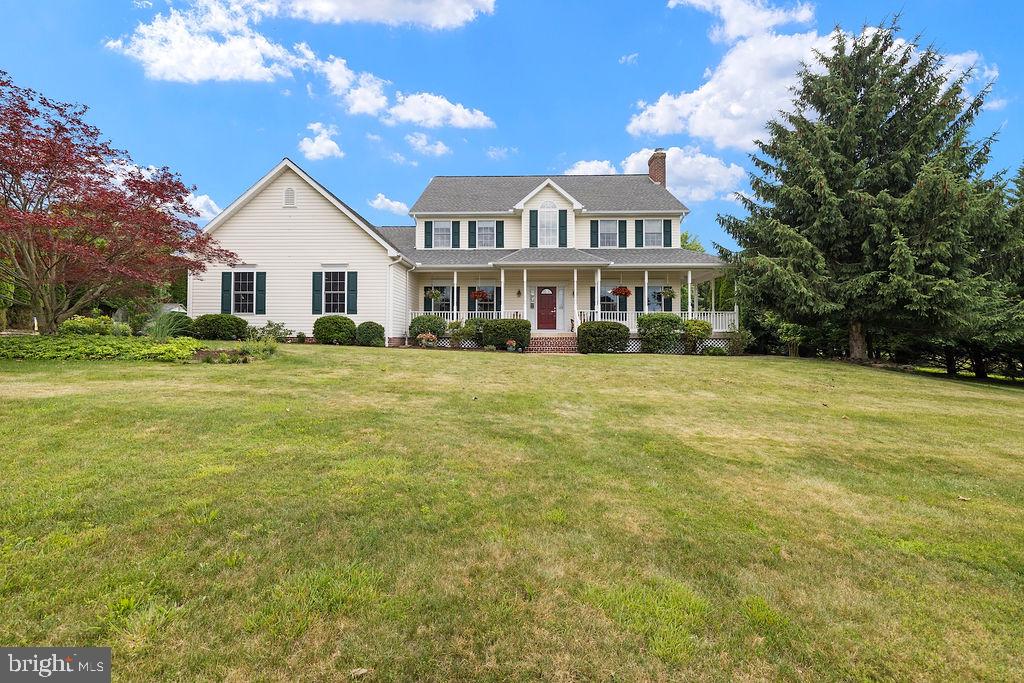 Exceptional 3,352 sq. ft. Colonial nestled in a private 10+ acre secluded setting and designed for both comfortable living and outdoor enjoyment. This thoughtfully maintained home features two spacious primary suites, including options on both the first and second floors, 3.5 baths, beautiful hardwood flooring, and solid-core wood doors throughout. The picturesque all-seasons room provides stunning views year-round and fills the home with natural light.

The oversized garage offers an epoxied floor and a heated workshop space, perfect for hobbyists, car enthusiasts, or additional storage needs. Outdoors, you'll discover an extraordinary retreat featuring expansive living and entertaining areas, a covered front porch, gazebo, tranquil goldfish pond, firepit area, leisure pool, and a large fenced garden with raised beds. Golf enthusiasts will appreciate the private driving and chipping range right on the property.

Offering a rare combination of quality craftsmanship, versatile living spaces, and resort-style amenities, this one-of-a-kind property delivers the perfect balance of privacy, recreation, and everyday luxury.