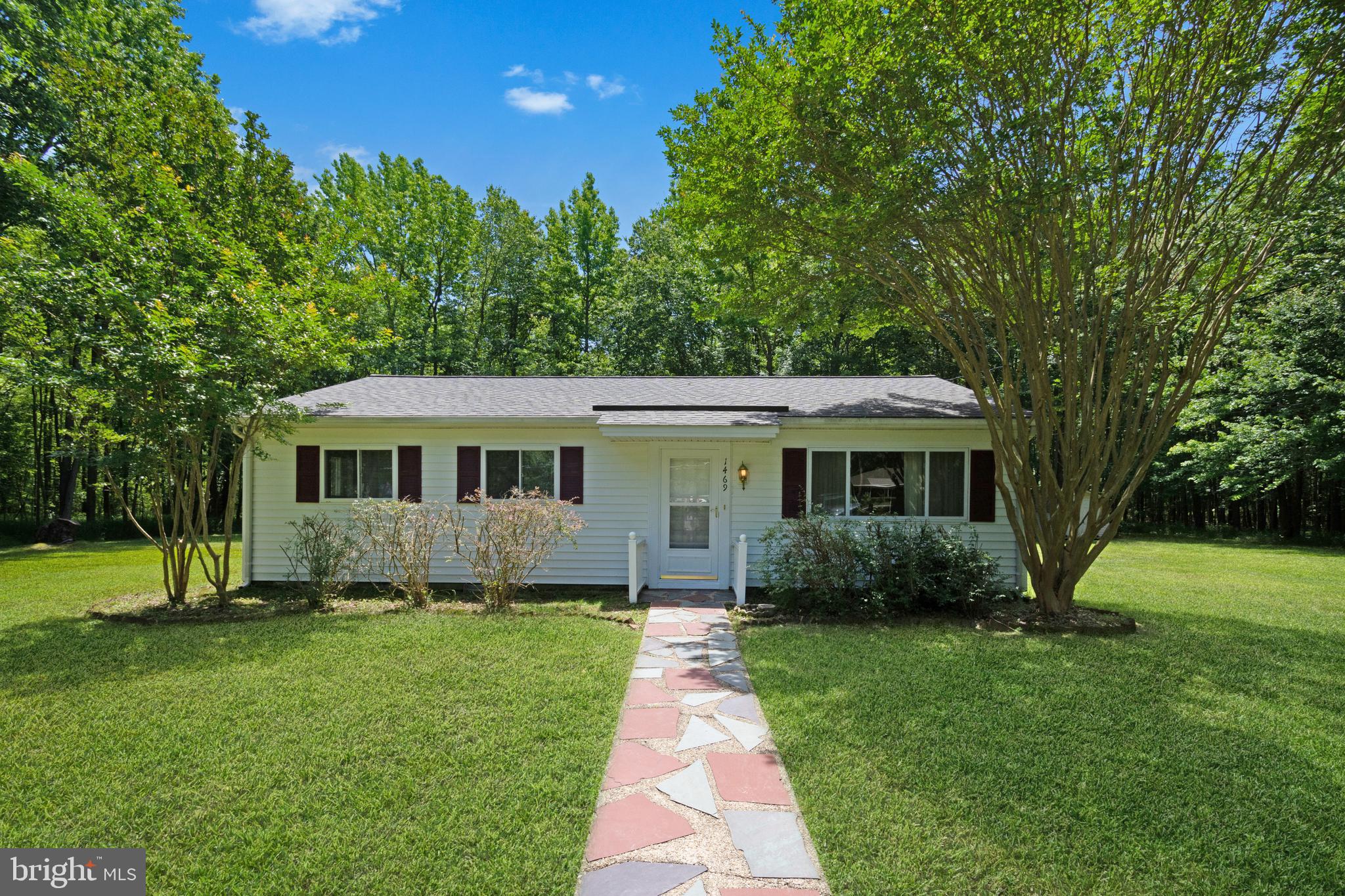 Renovated in 2016: new kitchen appliances, heat pump, washer, dryer, carpet at that time.  Big open section of yard is about 1/3 acre but lot extends way into the wooded area and is 3.75 acres! Lots of privacy, rear patio, shed new in 2016. Roof replaced 2020.  Extensive paved parking area.  Very well kept home.  Check out Cedarhurst community waterfront park on the bay a few blocks past the house! This property is Certified Lead Free.  Application online on Long & Foster website. $55 per adult to apply.  Each adult must submit an application to be considered. Good credit required. Pets case by case.