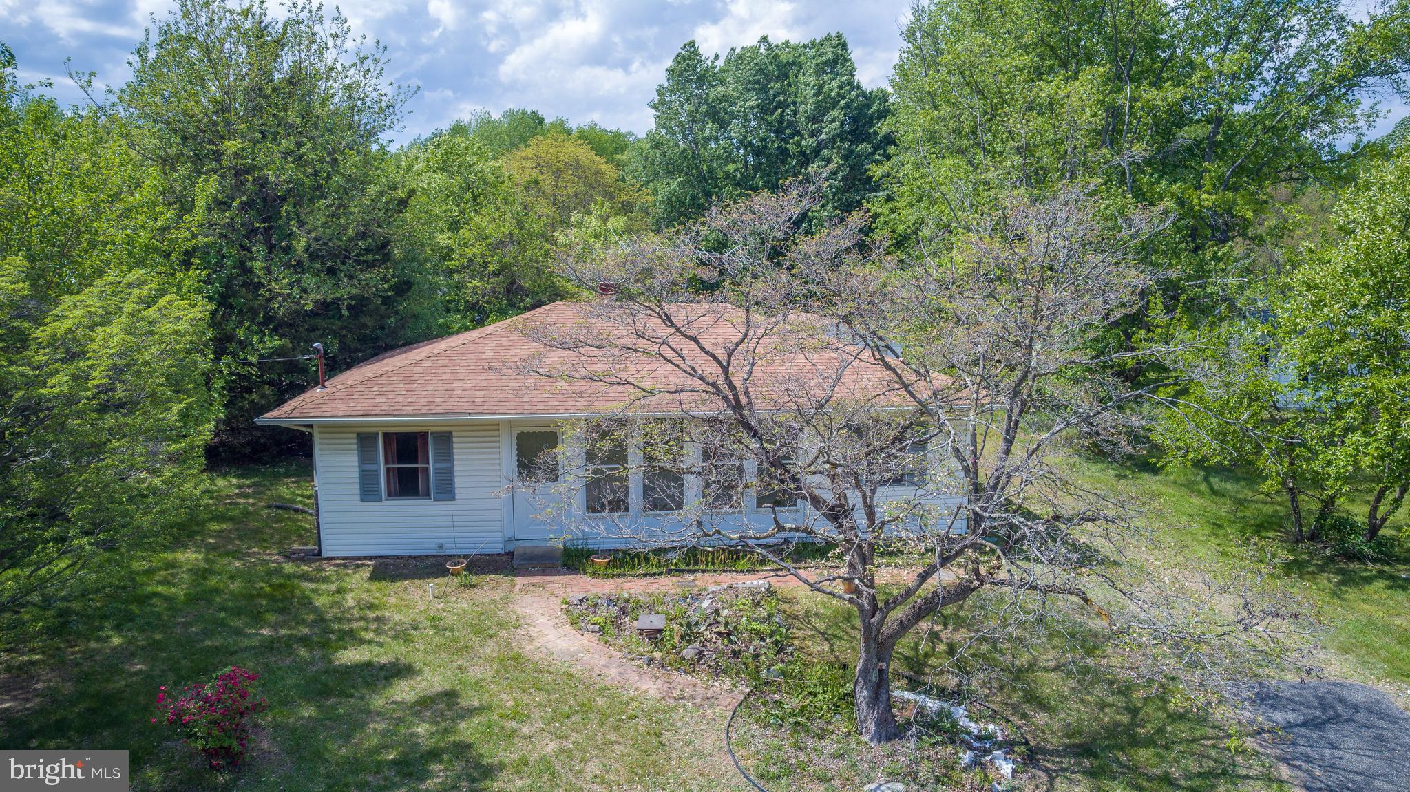OFFER DEADLINE Please have all offers sent to Corrie Robinson by 10:00 AM Wed May 14th

This cozy 3-bedroom, 1-bath home sits on over an acre of land, offering ample outdoor space for relaxation and recreation. The property features both front and rear enclosed porches, perfect for enjoying the outdoors in comfort. 
While the home requires some renovation, it boasts updated roofing and drywall, providing a solid foundation for your enhancements. The detached garage adds extra convenience and storage options.
With a little creativity and effort, this property can be transformed into your ideal haven. Don’t miss the opportunity to make it your own! Schedule a viewing today! This home is being sold as is