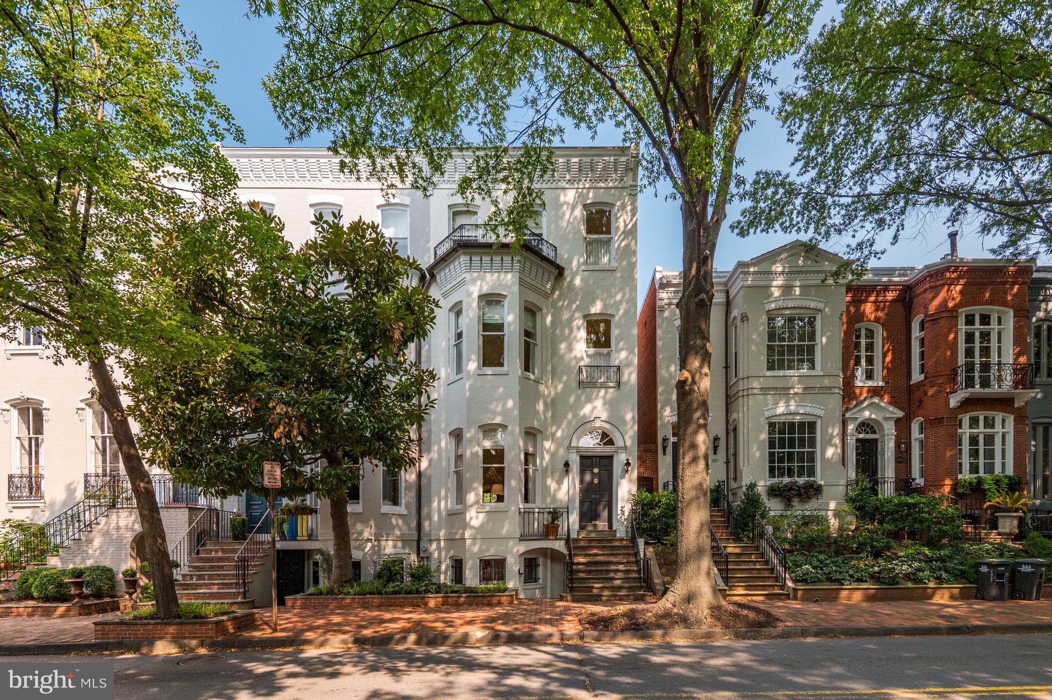 2819 Q Street NW is a beautiful, wide, bay-front Victorian rowhome on a spacious lot in Georgetown’s East Village. This four-bedroom, four-bathroom home is the perfect combination of historic beauty and modern luxury – offering a traditional floor plan and a spacious rear patio and garden. Up the front steps and through the vestibule you arrive in the formal living room boasting soaring 11’ ceilings, a wood-burning fireplace with a mantle, gorgeous crown molding, an ornate chandelier situated in the center of the room, gleaming hardwood floors, and floods of natural light. A hallway off the living room on the right leads to the gourmet kitchen and the formal dining room. The kitchen is fully equipped with professional stainless-steel appliances, gas cooking, quartz countertops, recessed lighting, ample cabinet space, and tile flooring – great for cleaning up accidental spills. The dining room can be accessed by the hallway, but is also conveniently located off the kitchen and features large windows, crown and chair rail molding, hardwood floors, and French doors that lead out to the spacious patio and garden. This outdoor space is fully fenced in with mature plants providing a canopy of shade and privacy – perfect for dining al fresco or entertaining.

Up the stairs on the second level and to the right is the owner’s suite featuring 10’ ceilings, bay windows, crown molding, two deep closets, a sitting area, and an en-suite bathroom. To the left of the staircase you’ll pass a hallway bathroom and at the end of the hall is the second bedroom boasting a gorgeous wall of built-ins aligning a charming gas fireplace with a mantle, a spacious closet, and a set of French doors to the balcony with lovely garden views – the ideal spot for your morning cup of coffee. 

The third level of the home holds two more large bedrooms and a hallway bathroom. The lower level of the home has been recently updated and features a spacious family room, a laundry area, and a third full bathroom. 2819 Q Street NW has been meticulously maintained and its location is unrivaled. You can have it all with this house – location, space, luxury, and comfort! Don’t miss your chance to call this beautiful house in a wonderful neighborhood your new home! (Owner RE Licensee)