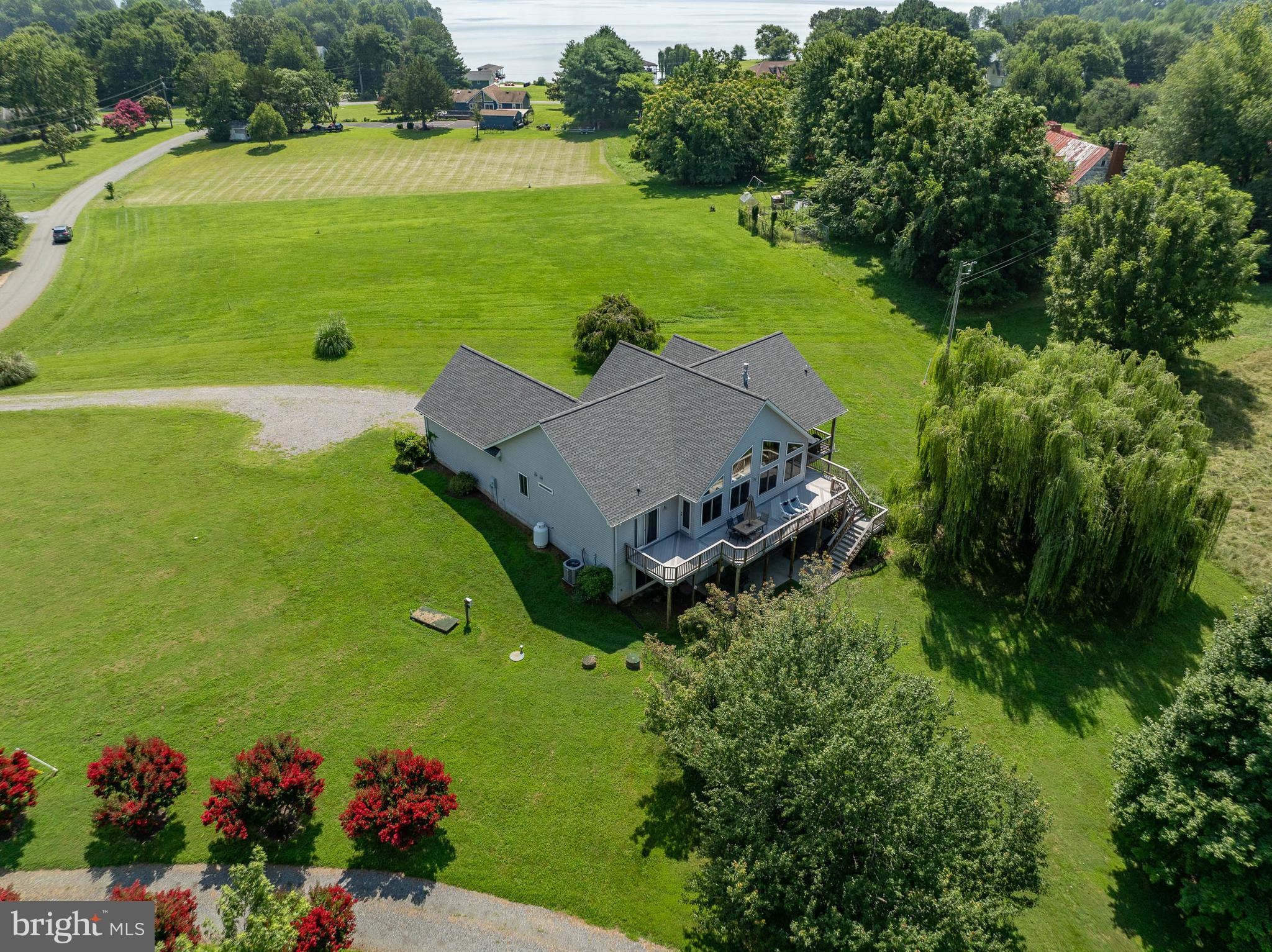 Welcome to an exceptional lakefront retreat in the prestigious Bear Castle community on the of Lake Anna—offering the perfect blend of refined luxury, relaxation, and income potential.
Perfectly positioned on a private 1.01-acre cul-de-sac lot with nearly 100 feet of waterfront, this stunning 4-bedroom, 3-bath custom home delivers the elevated lake experience today’s vacation renters seek. With expansive water views, high-end comfort, and turnkey convenience, this property is ideally suited for immediate income generation.
Inside, the open-concept design is bathed in natural light, with dramatic lake-facing windows ,rich wood flooring, a cozy fireplace, and thoughtfully designed gathering spaces create a warm yet upscale atmosphere.
The main-level primary suite and additional entry-level bedroom provide desirable accessibility for multi-generational guests, while the finished walkout basement expands entertainment space—ideal for game rooms, movie nights, or additional guest accommodations.
Outdoors, the experience truly sets this property apart. Guests can unwind on the expansive deck, relax in the hot tub, or enjoy seamless access to the water from the deep-water covered dock—perfect for boating, swimming, fishing, and watersports. These sought-after amenities significantly enhance rental appeal and occupancy.
Additional features include:
• 3,690 finished square feet designed for high-capacity hosting
• Offered fully furnished for immediate move in or rental readiness
• New roof (2023) for peace of mind
• New water pump and pressure tank (2026)
• 2-car attached garage 
• Hot tub and invisible fence convey

Located in a quiet, desirable waterfront community with lake privileges, this property offers the rare combination of privacy, luxury, and strong income potential on one of Virginia’s most in-demand vacation destinations. 
Whether you're expanding your short-term rental portfolio or securing a personal getaway that pays for itself, this Lake Anna retreat delivers both lifestyle and return on investment. Located near Lake Anna grocery, shopping, and more AND only 40 minutes from the new Kalahara Waterpark and Kings Dominion.