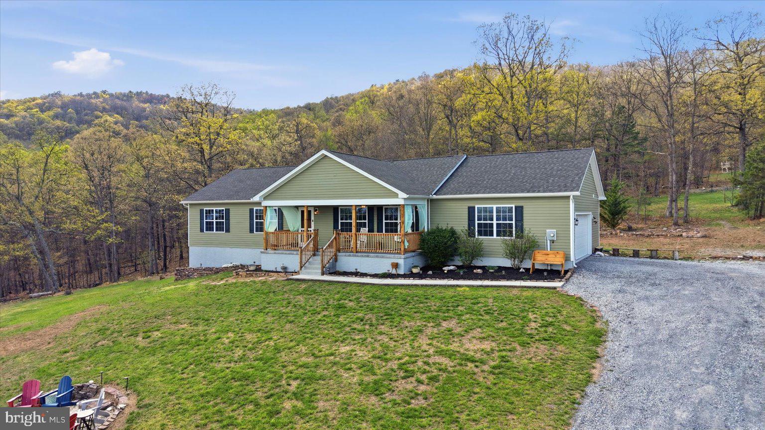 Welcome to 379 Jura Dr in Hedgesville, WV—where the views truly steal the show! Nestled on 6.75 private acres, this stunning property offers breathtaking mountain views in every direction, creating the perfect blend of peaceful living and everyday comfort.

Backing directly to the Sleepy Creek Wildlife Management Area, you’ll have nature right at your doorstep—perfect for hiking, fishing, hunting, and bird watching. Whether you’re an outdoor enthusiast or simply love the serenity of wide-open spaces, this location is truly special. And when you’re ready for a quick treat, you’re just 5 minutes from the local favorite, Ganotown Ice Cream!

Step inside to discover a beautifully designed open floor plan that seamlessly connects the main living spaces—ideal for both relaxing and entertaining. The heart of the home is the gorgeous, upgraded kitchen, thoughtfully equipped with a massive 10-foot island (complete with cabinets on both sides and built-in outlets), a double oven, pot filler, and a custom range with a premium ZLine hood. A brand-new refrigerator (installed November 2025) completes this impressive space—truly a dream setup for anyone who loves to cook or gather with family and friends.

This home features 3 spacious bedrooms and 2 full bathrooms, including a serene owner’s suite with a spa-like bathroom offering a jetted soaking tub and a separate stand-up shower—your own private retreat at the end of the day.

Outside, the property continues to impress. Enjoy quiet mornings or sunset evenings from multiple outdoor sitting areas, whether you’re relaxing in a hammock, sharing a meal at the picnic table, or gathering around the large fire pit in the front yard. The expansive acreage provides both privacy and endless possibilities.

Additional features include an oversized 2-car attached garage, a large WALK IN crawl space with double door access for easy storage, AND a Pioneer pole barn with a concrete floor and electric already run (just needing hooked up). This is a perfect spot for a shop, hobby area, truck/ toy storage etc! It does have a man door as well. 

If you’ve been searching for space, privacy, and unmatched views—this is the one. Don’t miss your chance to own this incredible mountain retreat!