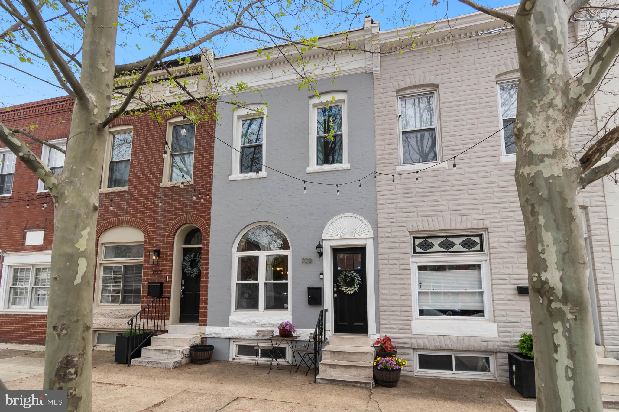 Welcome to this beautifully maintained home where Canton meets Brewer’s Hill! Step through the charming vestibule entry and take in the warmth of hardwood floors, exposed brick, and a cozy electric fireplace with mantle—creating the perfect ambiance for relaxing or entertaining.
The sun-filled eat-in kitchen offers generous counter space, abundant cabinetry, and natural light that makes every meal feel special. Step outside to an expansive rear deck, ideal for grilling, hosting, or simply enjoying a quiet evening outdoors.
Downstairs, the large finished basement with private rear access adds amazing flexibility—perfect for guests, a home office, or potential rental income. You'll also find dedicated laundry and plenty of storage to keep things organized.
Topping it all off is a coveted oversized parking pad—spacious enough for SUVs or trucks. With easy access to I-95, I-895, Johns Hopkins, downtown Baltimore, and all the dining, shops, and energy of Canton and Brewer’s Hill, this home offers the perfect mix of charm, function, and location.