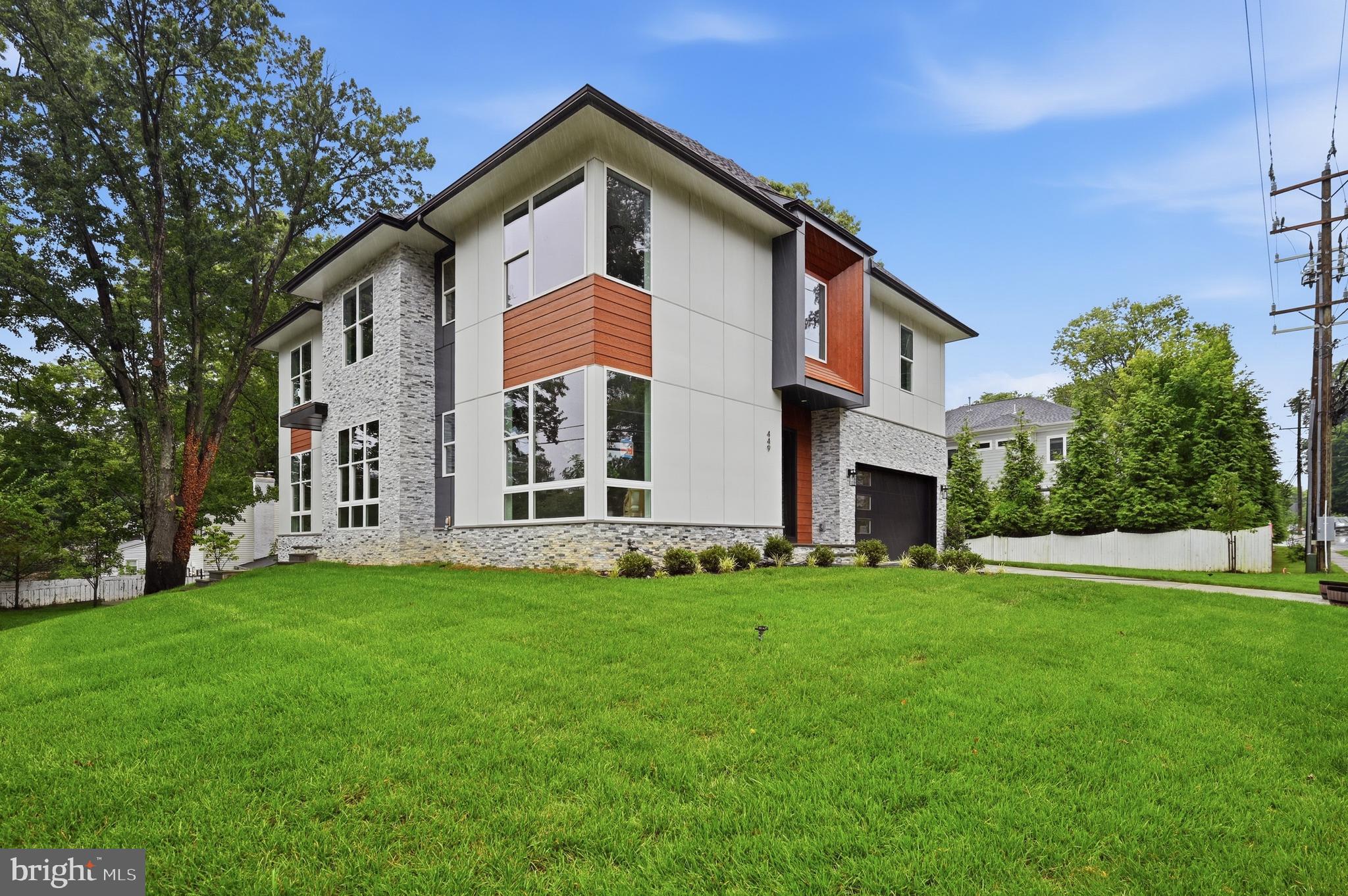 Introducing 449 Lawyers Rd NW, which is one of our most latest model "Cetus Model", Located in the heart of Vienna, this property offers a prime location just minutes from downtown shops, dining, and entertainment. With easy access to Route 123/Maple Ave major commuter routes and top rated Fairfax County Public Schools, this home provides the perfect balance of suburban charmand and urban convenience. Benefiting from a 0.27 acres lot, and boasting over 6,400 sqft of living space across three levels, this residence provides a sanctuary of indulgence and entertainment. The wetbar, gourmet kitchen and future Spice kitchen, adorned with high-end appliances, quartz countertops, and elegant maple cabinets, beckons culinary enthusiasts. A deck and Covered porch with gas fireplace extends the living space outdoors, perfect for dining and relaxation.

Crafted by Anchor Homes, this contemporary style abode exudes luxury at every turn. The primary suite indulges with a palatial closet, a decadent freestanding tub, dual vanities. The fully finished basement is a haven of leisure, featuring a media room, wet bar, and a sprawling recreation area finished with Luxury Vinyl Flooring. Each bedroom is appointed with its own walk-in closet, ensuring ample storage solutions for residents.

Builder is offering a lender discount of 0.50% of the loan amount when using builder's preferred lender and title company. Don't miss this opportunity to acquire a residence meticulously designed for luxurious modern living. Seize the chance to make 449 Lawyers Rd NW your distinguished address in Vienna.