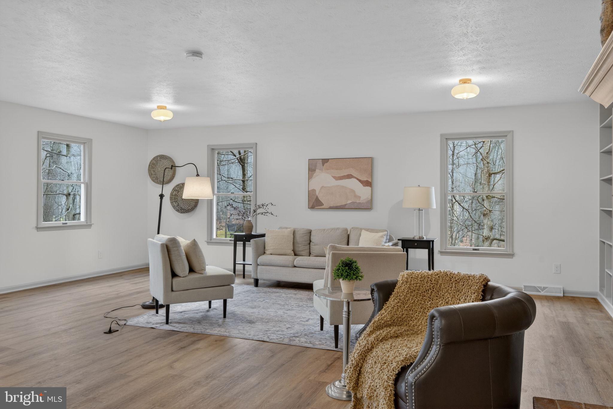 Welcome home to an exceptional, fully renovated home in the popular White Rock Acres—where sophisticated design, high-end finishes, and effortless living come together in perfect harmony.
No detail has been overlooked, with extensive upgrades including new HVAC, a newer roof, and enhanced efficiencies such as a central vacuum system, for maintenance free living. Every element of this home has been thoughtfully selected to create a seamless blend of luxury and livability. 
This gorgeous home is enhanced by luxury flooring, designer lighting, and an abundance of natural light that highlights every well-chosen detail.  The added first floor primary suite provides a serene retreat, complete with a spa-inspired bathroom showcasing upscale finishes, modern fixtures, and a tranquil ambiance. 
Inside, you are immediately greeted by an expansive family room with tons of light, built in bookshelves, and a gorgeous fireplace. The eat-in gourmet kitchen is perfect for preparing family meals with custom cabinetry, striking quartz countertops, an elegant tile backsplash, and premium stainless steel appliances—ideal for both intimate gatherings and elevated entertaining. A formal dining room is perfect for Holiday dinners.  Four additional second floor bedrooms, including a second en suite, are generously sized, offering flexibility for a growing family and guests.
Step outside onto the large deck to a beautiful wooded retreat, perfect for outdoor entertaining or quiet evenings enjoying the peaceful surroundings of Cumberland County. This home offers the best of both worlds: a quiet, established neighborhood setting with easy access to the dining, shopping, and cultural scenes of Mechanicsburg and Camp Hill, while being just a short drive to Harrisburg for an easy commute or a night out in the capital city.  Outdoor enthusiasts will appreciate nearby parks, walking trails, and scenic countryside, offering endless opportunities to explore and unwind. 
A rare opportunity to own a luxury home in White Rock Acres—schedule your private tour today and experience elevated living at its finest.