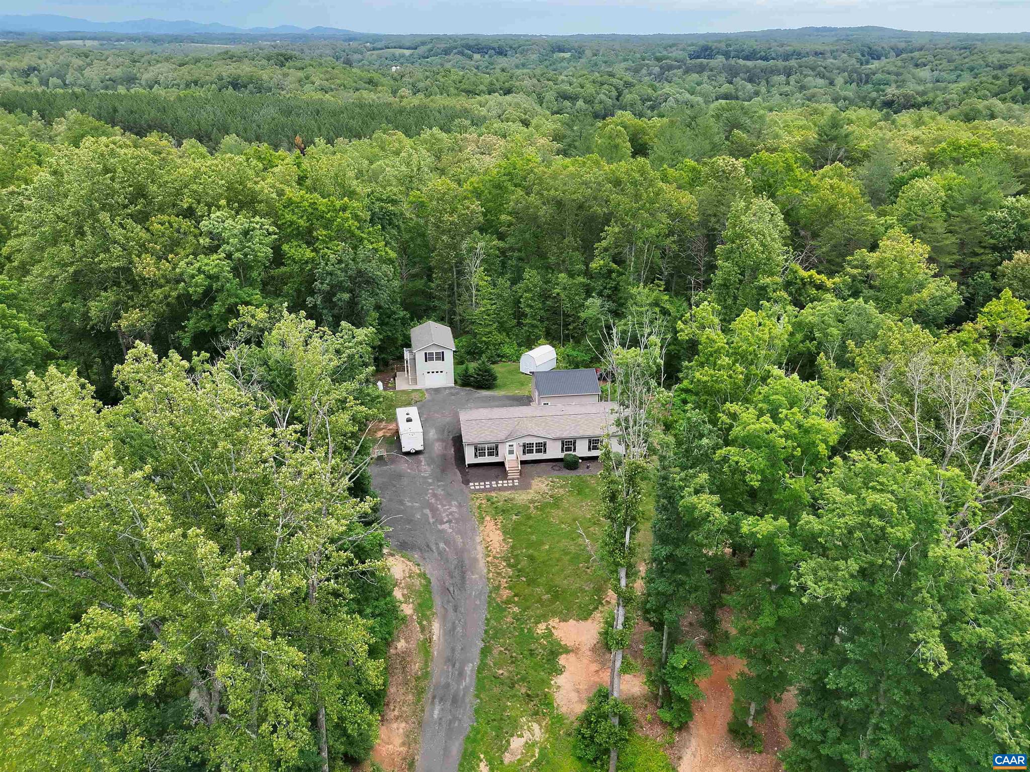 Welcome to 6031 Celt Road-an opportunity to have space, independence, and the freedom to live life you've been dreaming of. Set on 2 acres, this updated single-family home offers a blend of open and wooded land?ideal for gardening, small livestock, outdoor projects, or simply enjoying the privacy of your own homestead. The 4-bed, 2-bath main home has been thoughtfully refreshed with new flooring throughout, a remodeled kitchen and bathrooms, new appliances, and a brand-new rear deck. A newly added linen closet in the primary bath adds everyday convenience. What truly sets this property apart is the fully permitted, two-level accessory dwelling unit. With 576 sq ft, a full kitchen, 1 bedroom, 1.5 baths, and its own garage, this space is perfect for multigenerational living, rental income, or private workspace. An additional detached garage with 30-amp RV hookup adds utility for tools, equipment, or hobbies. Between the two garages and the ADU, you?ll have the functional space homesteaders dream about. Located in Greene County, just minutes from Stanardsville and Albemarle County, and within reach of Charlottesville and even Harrisonburg, this property offers country living without sacrificing accessibility. Agent related to seller.