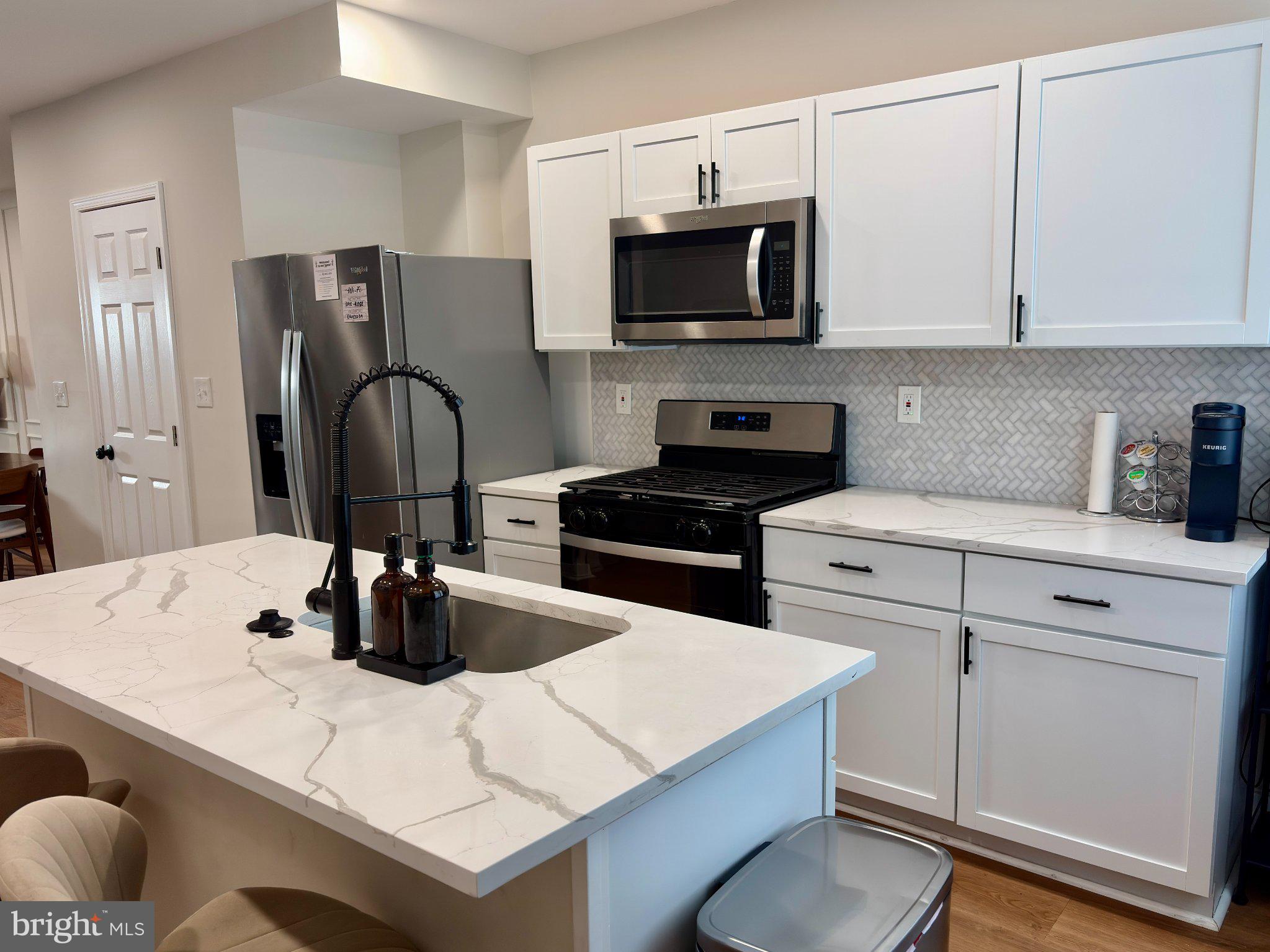 Welcome to this beautifully move-in-ready, updated Baltimore rowhome offering the perfect blend of space, style, and convenience. The main level flows effortlessly—ideal for both everyday living and entertaining—leading into a stylish kitchen with ample cabinetry and room to gather. Upstairs, you’ll find generously sized bedrooms along with 2 full bathrooms, providing comfort and flexibility for any lifestyle. The fully finished basement adds valuable living space, perfect for a guest suite, home office, gym, or entertainment area. Step outside to your private backyard—ideal for relaxing evenings or hosting friends. All of this in a location that truly delivers—just minutes from Patterson Park, the vibrant waterfront at Canton Waterfront Park, and the shops, dining, and nightlife of Fells Point. Whether you're a first-time buyer or looking to invest, this move-in-ready home offers incredible value in one of Baltimore’s most sought-after areas.