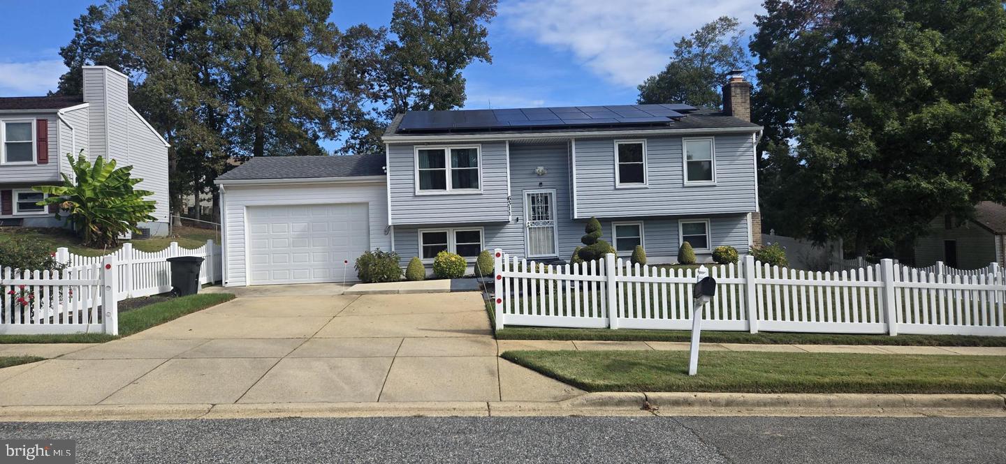 Nestled in the charming Clinton Woods neighborhood, this delightful split foyer home offers a perfect blend of comfort and functionality. Built in 1984, this well-maintained residence features three spacious bedrooms and two full bathrooms, making it an ideal retreat for those seeking a cozy yet functional living space. Enjoy discounted electric bill with the PAID OFF Solar Panels. Step inside to discover a fully finished daylight basement, perfect for a family room, home office, or play area. The inviting ambiance is enhanced by a warm fireplace, creating a perfect spot for gatherings or quiet evenings at home. The open layout allows for seamless flow between living spaces, ensuring that every corner feels connected and welcoming. The exterior boasts low-maintenance vinyl siding, while the attached front-entry garage provides convenience and additional storage. Enjoy the tranquility of a generous 0.21-acre lot, offering ample outdoor space for gardening, entertaining, or simply unwinding in nature. Located in a peaceful community, this home is just a short drive from local amenities, parks, and recreational areas, making it easy to enjoy the best of suburban living. With its thoughtful design and inviting features, this property is ready to become your sanctuary. Don't miss the opportunity to make this charming residence your own!