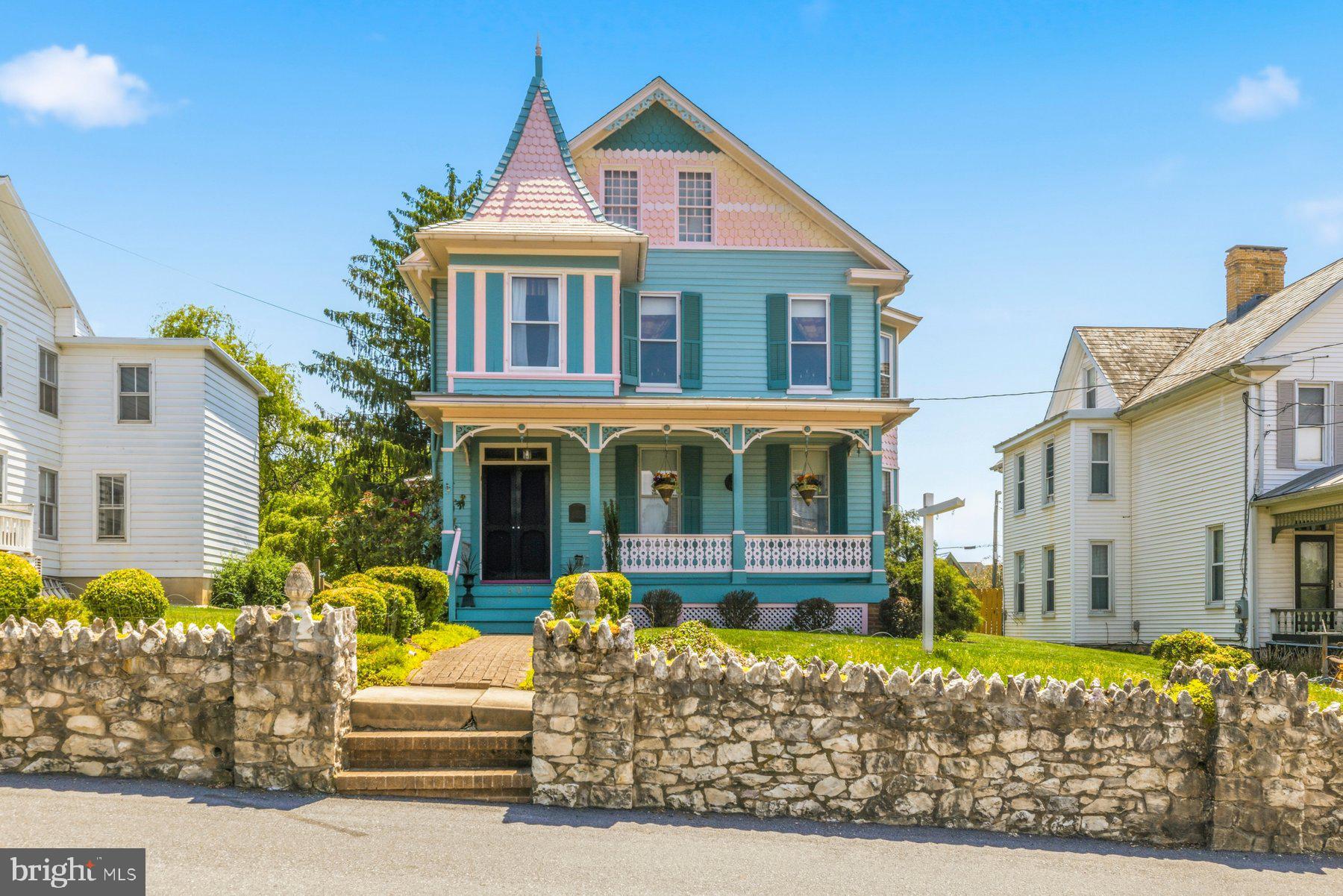 Discover this magnificently unique "Painted Lady" Victorian nestled in the heart of historic New Windsor! Originally built in 1888, this home beautifully pairs the timeless charm of its 138-year backstory with modern updates for effortless comfort. This rare find features 3 bedrooms, 2 full baths, and a versatile bonus room upstairs—perfect for a dedicated work-from-home space. Inside, dual staircases add a touch of historic character and architectural flair, while a large attic and a walk-out basement provide abundant extra storage. At the heart of the home, the modern kitchen features beautiful cabinets proudly produced and crafted just down the road right here in New Windsor. Outside, enjoy a meticulously manicured yard and a detached, fully powered one-and-a-half-car garage with convenient rear-alley entry and parking for up to four vehicles. Brimming with original character and completely move-in ready, this one-of-a-kind beauty eagerly awaits its next owners. Schedule your tour today and make this authentic piece of history your own!