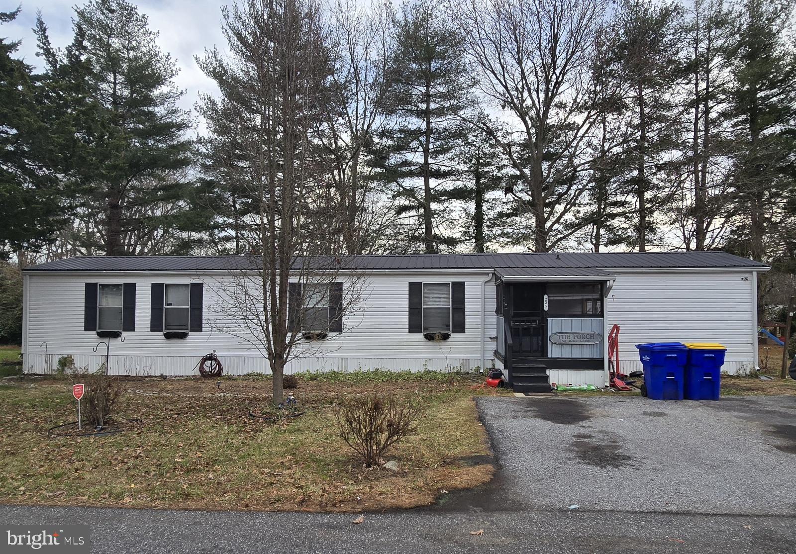 The single wide unit on a spacious tree-lined lot is ready for occupancy. The quiet, park-like setting offers direct access to Route 13, located south of Cheswold and north of Dover.  
Sunlight and shade grace this hidden gem both indoors and out. The back yard oasis, enhanced with a wide sundeck, is screened with privacy fencing. Steps away, find outdoor storage. The home and appliances are being sold as-is. Buyers will need an approval from the park before offer can be fully ratified.