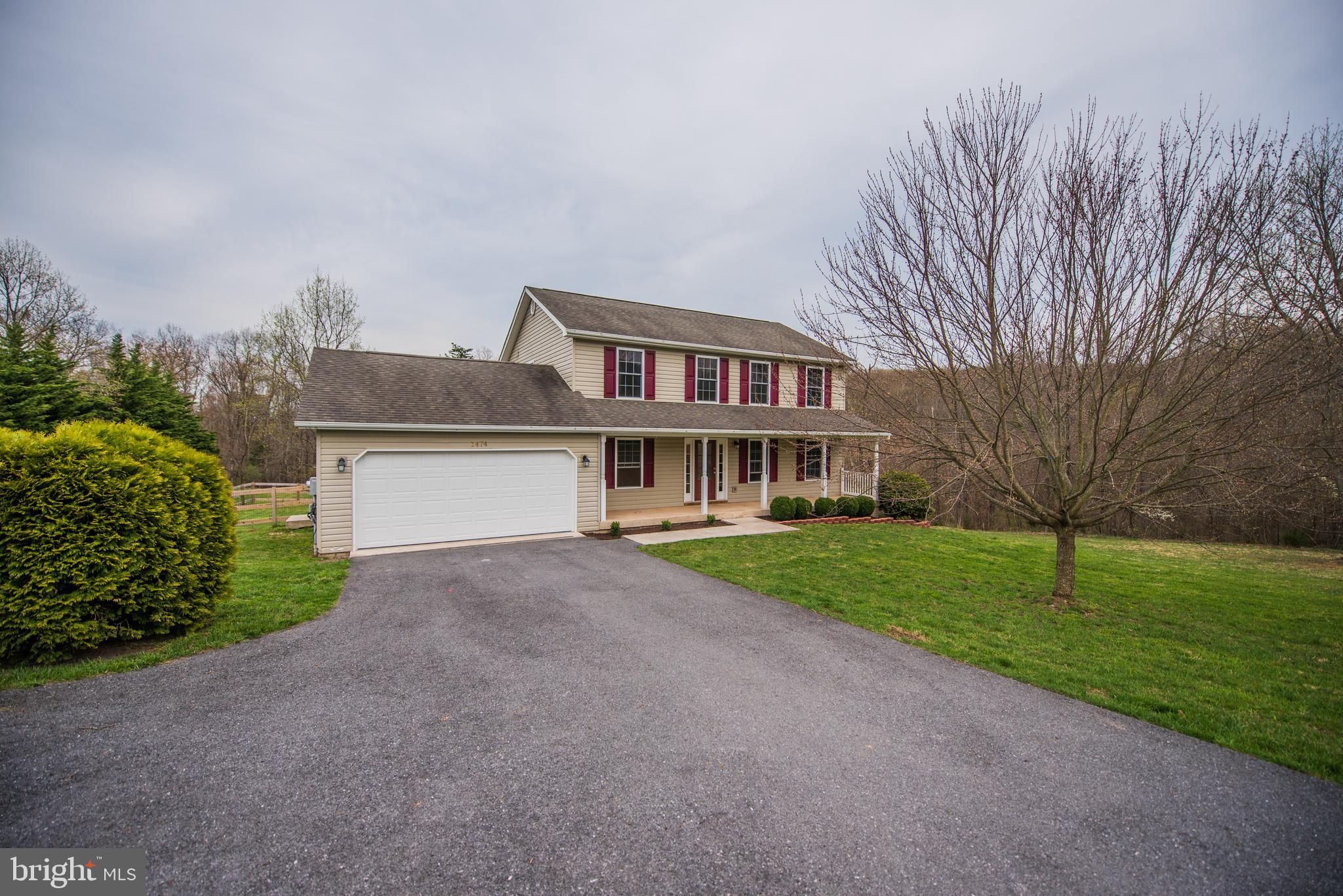 Come to the countryside and enjoy living in this beautiful colonial. Has a large back deck for entertaining and relaxing. The 9.14 unrestricted acres is mostly wooded with a creek running through the center of the property. Also has a wet weather stream. Property is all easily accessible. Home has 4 BR 2 FBA upper level. Main Living area has eat in Kitchen,  Family room, Living room, Formal dining room and a half BA. Has finished basement with Family room, Bonus room and a half BA. with  walkout level to back yard. Garage is on Main level off the kitchen. Sliders from Family room to the rear deck. Outside electric hookup for RV.