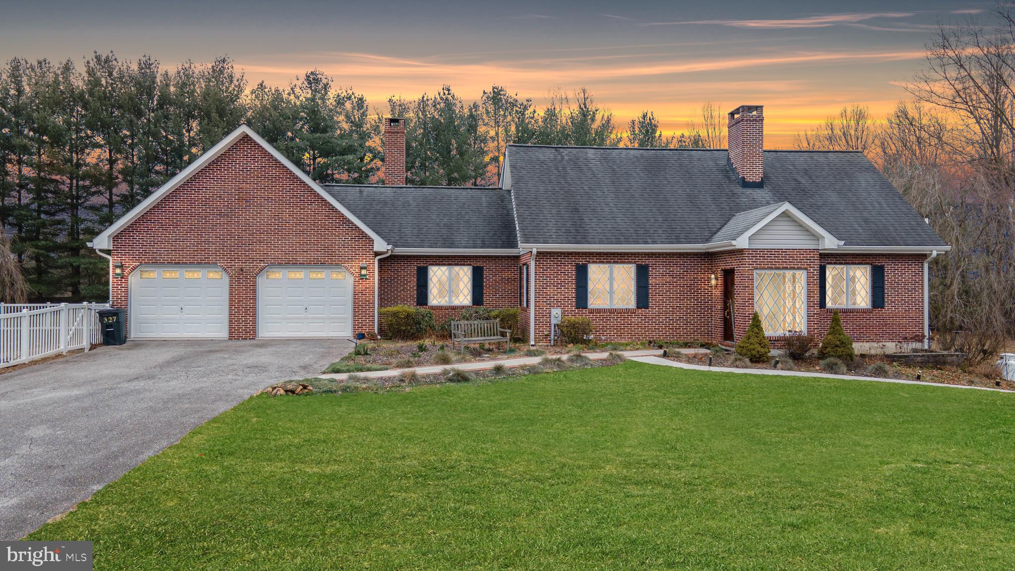 Nestled on nearly 10 private acres of meticulously landscaped grounds, this tastefully appointed custom-built Cape Cod home, accompanied by a vast level pasture, in-home greenhouse and flourishing, native gardens, offers an exceptional blend of elegance and functionality before even entering the inside.

The estate includes a fully equipped beautifully designed stable with 5 stalls, electric and running water, French drain, drive through doors and a 12x12 tack room. Additionally, a 30x40 pole barn with a commercial 60-gallon air compressor presents a versatile space for all you have planned.  Let your dreams begin!

As you enter, a sun-filled marble entryway, adorned with exposed brick, sets the tone for the custom craftsmanship found throughout.  A guest bathroom complete with Italian marbles adds beauty and convenience. Notable features include two interior wood burning fireplaces, Pella sliding glass doors, crosshatch detailed Pella windows with hidden screens, and an array of personalized finishes.

The main level exudes warmth, boasting a family room with solid oak floors and an interior wood-burning fireplace, seamlessly flowing into an elegant dining room. From the dining room a covered patio offers panoramic views of the lush green landscapes that surround this home. The chef- inspired kitchen showcases granite countertops, hickory cabinets, a Viking range, and top-of-the-line stainless-steel appliances, creating a culinary haven. The kitchen is open to a living area which offers another wood burning fireplace ideal for both casual dining and entertainment.

A heated/cooled sunroom with commercial-grade oversized windows captures the natural beauty of the estate, providing versatile spaces for relaxation or a greenhouse oasis. A charming main-level bedroom/den with new carpet adds to the versatile layout on this level.

The upper level houses a primary suite boasting ample closets with thoughtful uses of space and a luxurious primary bath with granite flooring and a custom granite shower. Two additional bedrooms and another full bath complete this level.

The fully finished lower level offers an in-law suite, private office suite or expansive entertainment center with a separate entrance, two walk-in closets and laundry facilities. It features luxury vinyl plank flooring as well as recessed lighting.

Noteworthy enhancements include a heated garage with a separate bedroom/guest suite with a bathroom located above, new Trane HVAC, two 200-amp electric panels with a generator plug, UV light, a water filtration system, and much more, ensuring both comfort and efficiency.

This extraordinary residence, with its unique blend of architectural elegance and expansive grounds, presents an unparalleled opportunity for luxurious country living.