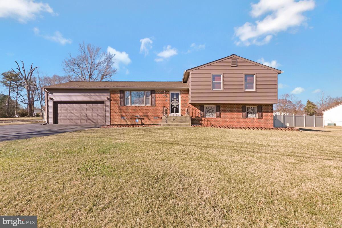 This lovely home is situated in a corner fully fenced lot.  A  bright entryway to a cozy living room takes you to an extended family room.   A  renovated kitchen is equipped with new stainless steel appliances and new waterproof luxury vinyl floor.    The renovated master bath  with freshly painted walls looks great.   A comfortable set up for a bedroom on the second level  provides privacy and extra space.  The lower level has new carpet.  New furnace, new water heater, new gutters.   A very convenient location.. .. bus commuter lot is less than a mile.  Location will qualify for USDA loan.