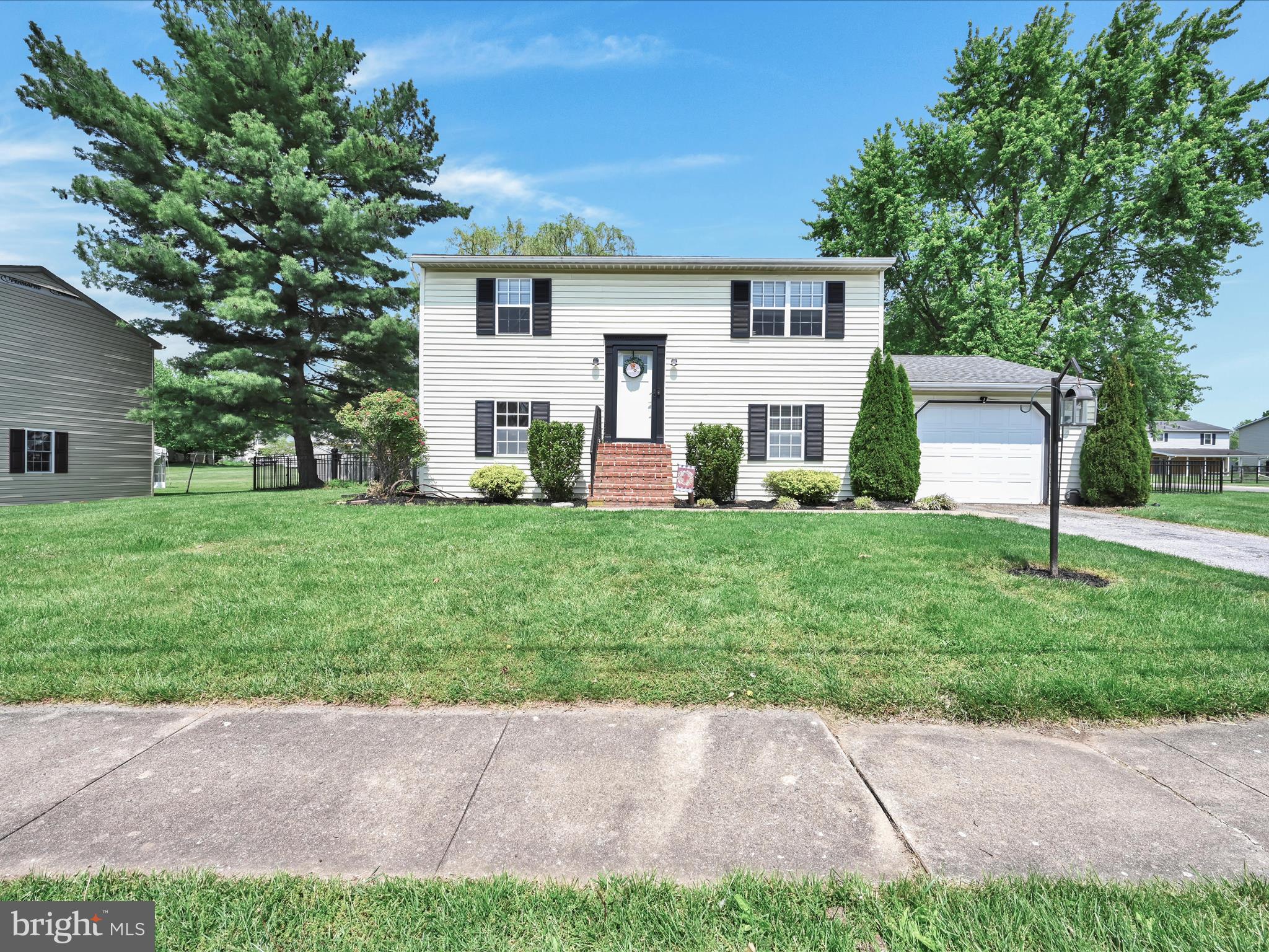 If you are looking for a home in West York School District with the best lot around, look no further! This split-level home with 3 bedrooms and 2 full bathrooms,  is minutes from Rt. 74, close to Sunset Lane Park, directly across the street from the Trimmer Elementary School fields and convenient to all amenities and Rt 30.  This level, corner lot is shaded and fenced in! Perfect for outdoor entertainment this summer!  Two bedrooms on the first floor are spacious and have ample closet space.  The first floor layout is great for entertaining as it has a cozy living room, an open-concept kitchen, and a dining area.  The lower level has an additional bedroom with a full bathroom and has a family room which leads out to the oversized patio!   Schedule a showing today and be over into this house in time to enjoy your summer in the shade trees of this amazing yard!