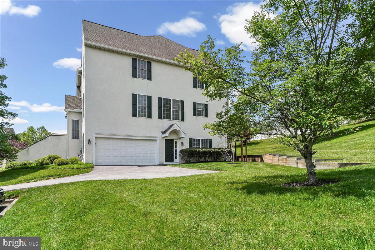 Nestled in the desirable Penn’s Preserve community, this well-maintained end-unit townhome offers approximately 2,664 square feet of living space with a functional layout designed for everyday living and entertaining. The main level features hardwood floors, large windows, and abundant natural light throughout. A gas fireplace anchors the living area, which flows seamlessly into the dining space in an open-concept design. The updated eat-in kitchen includes white cabinetry, quartz countertops, newer stainless steel appliances, and access to the rear deck, ideal for outdoor dining and entertaining. The upper level includes a spacious primary suite with vaulted ceilings, walk-in closets, and an en-suite bath with dual sinks, soaking tub, and stall shower. Two additional bedrooms, a full hall bath, linen closet, and laundry area with newer washer and dryer complete this level. The lower level offers additional living space with a fourth bedroom featuring a walk-in closet, a powder room, and access to the attached two-car garage. Additional features include a newer HVAC system, low-maintenance living, and a convenient location near West Chester Pike, shopping, dining, parks, and major commuter routes, within the Great Valley School District. Conveniently located near Ridley Creek State Park and Okehocking Preserve, offering easy access to scenic walking trails, outdoor recreation, and nature while still being close to shopping, dining, and major routes.