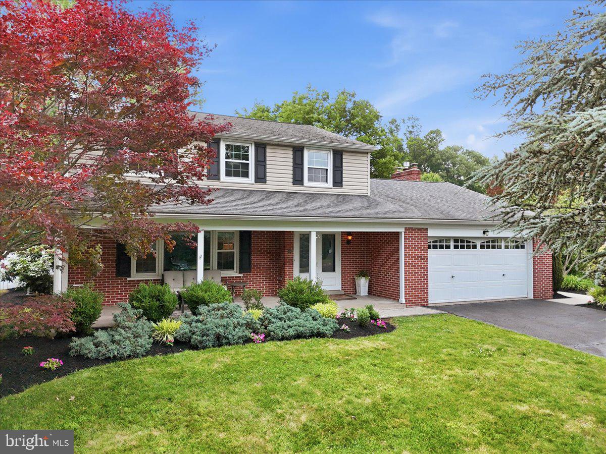 Don’t miss this beautiful Jonas Hagey colonial in the highly sought-after Pennwood Gardens community of Montgomery Township and top-ranked North Penn school district. This truly turnkey home offers timeless curb appeal and thoughtful updates throughout—all you have to do is move in!



A welcoming front porch looks out over a spacious front yard, setting the tone for morning coffee or evening unwinding. Step through the double front doors into the tiled foyer with new, modern light fixtures and coat closet. The layout flows seamlessly from the entryway into a spacious living room with custom cellular shades, lighted built-in shelving, original hardwood floors, and a large picture window. The living room connects to a formal dining room perfect for everyday meals or effortless entertaining, and that overlooks the lush back yard.



Open to the dining area is a stunning chef’s kitchen that’s full of natural light and intuitively arranged for both cooking and conversation. A two-tier 8-foot granite island and Dacor 5-burner gas cooktop anchor the space and are joined by stainless steel appliances, including a new-in-2026 KitchenAid dishwasher; ample cabinetry; and plenty of granite counter space. Just off the kitchen is a second living room that features a gas-burning fireplace with granite surround and custom mantel, along with sliding-door access to the back yard and newer (2023) paver patio—an ideal setup for grilling, playing yard games, or gathering around the fire pit.



The fully fenced-in back yard offers a relaxing retreat surrounded by mature landscaping, including a majestic silver leaf maple, lilac, dogwood, roses, and azaleas, just to name a few. A double fence gate makes it easy to maintain lawn care with a ride-on mower, while a standalone shed offers additional storage for lawn and garden tools. A half bath and access to both the finished basement and attached garage complete the main floor.

The lower level adds approximately 700 square feet of additional living space designed for entertaining and relaxation, featuring in-wall/ceiling surround sound and theater-style TV setup, custom wine storage and built-ins, a large pantry, half bath, laundry room, and additional storage area.



Upstairs, you’ll find four spacious bedrooms, all with original hardwood flooring and more custom window coverings, including blackout shades in the primary suite. Both en suite and hall baths feature granite countertops and high-quality finishes. A smart thermostat easily controls central air conditioning across both floors.



Additional highlights include a two-car attached garage with pull-down stairs to attic storage, and the home’s proximity to everything you might need or want, including walkable access to the train station for an easy Center City commute and a neighborhood path to Bridle Path Elementary. This home is in an unbeatable location to parks, trails, tennis courts, everyday shopping (Airport Square, movie theaters, Target, Trader Joe’s, etc.), and local downtown Lansdale businesses and restaurants, while also offering convenient access to Routes 309, 202, and the PA Turnpike.