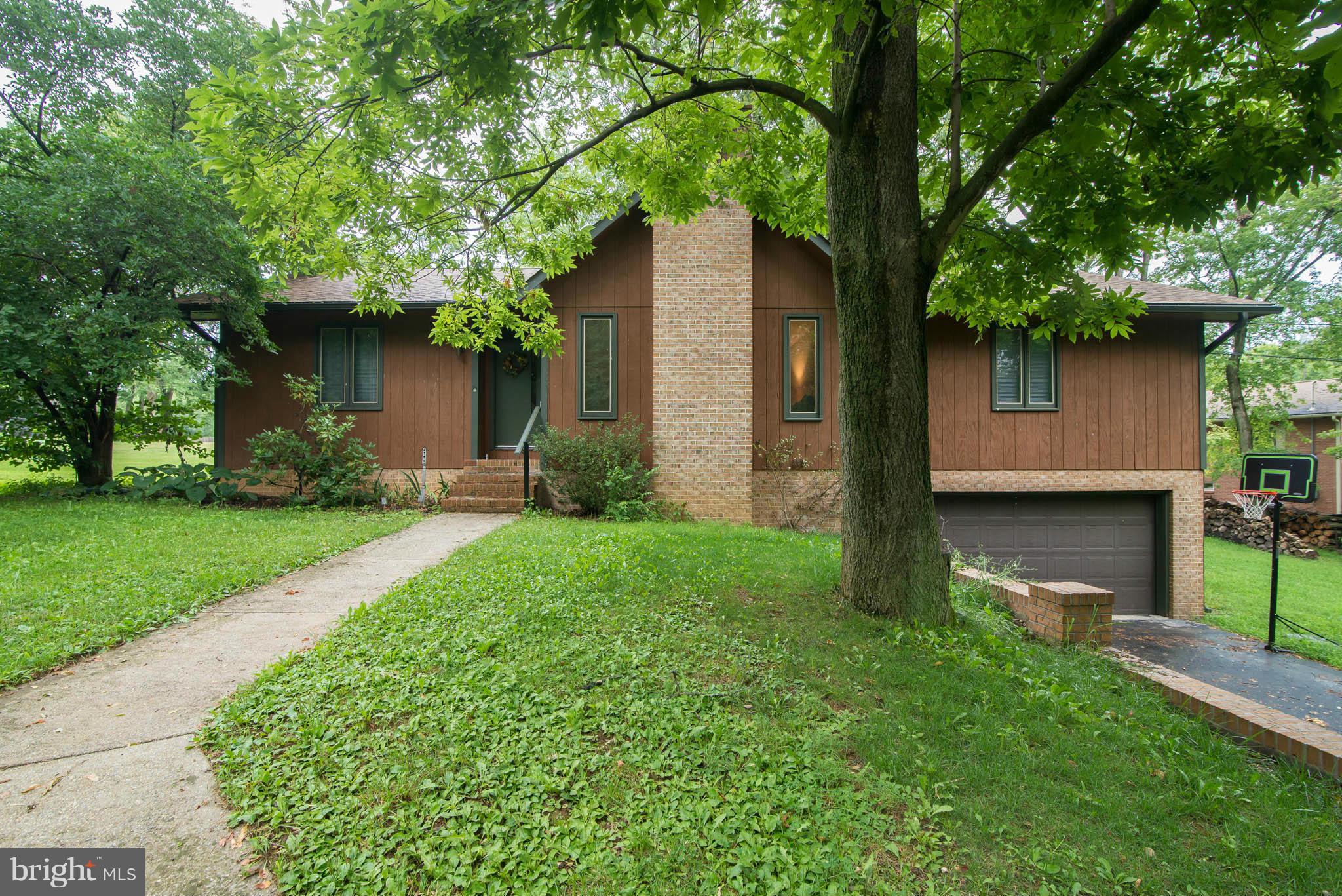 Price Reduced! Beautifully Well Kept Rancher,Main Level Living,  Oversized Living Room With Cathedral Ceilings, Fireplace, 1,536 Square Feet Of Living, Main Level Master Bedroom,  Newer Carpet Throughout Main Level, 2 Car Attached Garage, 10x12 Deck, Basement Storage Space, .66 Acres, Natural Landscape Of Mature Trees And Rocks!  Privacy And Located On A CuldeSac.