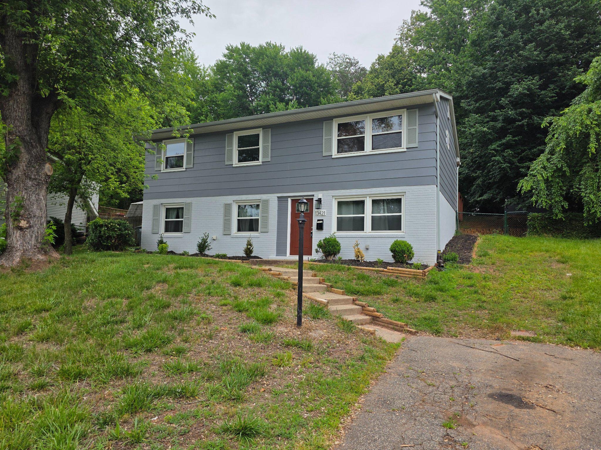 Discover the charm of this Colonial-style home nestled in the heart of Dale City with lots of updates and upgrades throughout. Newly installed roof, Central AC & Forced Air Heat, Granite Countertops along with brand new carpet to match the new interior and exterior paint!  With 1,717 square feet of thoughtfully designed living space, this home has four spacious bedrooms and two full bathrooms, perfect for both relaxation and entertaining. Step outside to enjoy the expansive 0.26-acre lot that backs to woods, featuring a nice sized shed that offers endless possibilities-whether for storage, a workshop, or a creative retreat. The property is surrounded by lush greenery, providing a serene backdrop for outdoor activities and gatherings. The kitchen is equipped with new stainless steel appliances, including a gas oven/range and refrigerator, making meal preparation a delight. The front entrance basement adds convenience and easy access to the main floor bedroom, enhancing the functionality of this lovely home. Located in a vibrant community, residents benefit from nearby parks, recreational facilities, and a welcoming neighborhood atmosphere. Excellent schools are just a stone's throw away, ensuring quality education for all ages. Enjoy the convenience of off-street parking and easy access to public services like commuter lots, making daily life a breeze. This home is not just a place to live; it's a lifestyle waiting to be embraced. Experience the perfect blend of comfort, community, and convenience in Dale City-where your dream home awaits!