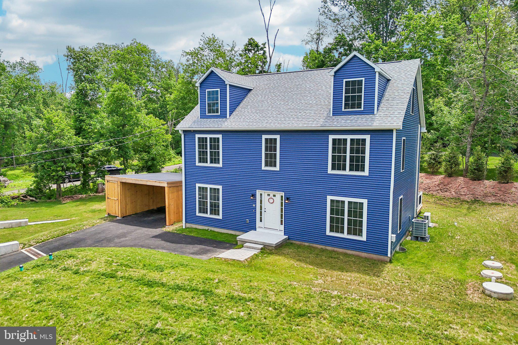 Tucked away in highly desirable Schuylkill Township, 40 Creek Road is a stunning, one-year-old sanctuary that flawlessly balances peaceful seclusion with modern, worry-free construction. This extraordinary property offers a rare opportunity to own a nearly brand-new home with a warm, inviting soul that is simply waiting to frame your memories. Your journey begins the moment you step toward the charming entryway, offering a subtle touch of elegance that welcomes you to the front door. Everyday convenience has been thoughtfully woven into the exterior design, featuring a covered carport with an attached storage shed, the perfect place to keep your tools, bikes, and outdoor gear organized and protected. From the moment you step inside, the home wraps you in quality and comfort. Gleaming hardwood floors guide you through the entire main level, leading elegantly up the stairs and continuing down the second-floor hallway. Life changes, and this home is designed to adapt to your story. A bright, versatile first-floor bonus room can be transformed into exactly what you need at this season of life, whether you envision a joyful playroom, an elegant formal dining room, or a cozy den for weekend movie nights. Moving into the heart of the home, the kitchen awaits. Outfitted with stainless steel appliances and stunning upgraded countertops, this space will serve as the beautiful backdrop for countless family meals, late-night chats, and holiday baking. To complete the aesthetic, beautiful, matching ceramic tile flooring flawlessly ties the kitchen and bathrooms together, creating a cohesive, designer feel throughout the entire house. As you head upstairs, the second floor offers a perfect layout for restful living, featuring three beautifully appointed bedrooms. The primary suite serves as a peaceful, private retreat, while the two additional large bedrooms provide exceptional space and feature great closets to keep everything perfectly organized. Beyond these traditional living quarters, this home holds a spectacular surprise: a fully finished third floor. This expansive, sunlit level provides two more bedrooms, but its potential is limitless, serving as the ultimate quiet retreat for a secluded home office, a sprawling playroom, a teen hangout, or a private guest suite. Downstairs, the unfinished basement offers a sprawling blank slate. Whether you dream of a home gym, a master craftsman's workshop, a home theater, or the ultimate entertainment lounge, this space is a canvas waiting for your exact vision. Around back, a cobblestone paver walkway leads you to your expansive, private deck. Picture yourself sipping your morning coffee here, looking out over a beautifully secluded lot that melts seamlessly into a lush, tranquil wooded backdrop. When you want to escape into the outdoors, Valley Forge Park, Pickering Creek and the Schuylkill canal are right nearby. This location is an outdoor enthusiast's dream, with endless opportunities for biking, and hiking all right nearby or carry your kayak across the road and off you go. Yet, despite this profound sense of tranquil seclusion, you have the absolute best of both worlds: you are located just minutes from the vibrant energy of exciting Bridge Street, offering immediate access to Phoenixville's best dining, shopping, and local festivities. Beyond its beautiful finishes, 40 Creek Road is designed for modern efficiency and ultimate peace of mind. Exceptional insulation keeps your spaces perfectly comfortable year-round while lowering energy costs. Even better, say goodbye to monthly water and sewer bills thanks to a brand-new well and septic system. Enjoy move-in-ready luxury and long-term savings. This is more than just a house; it is a quiet retreat from the world, a place to breathe deeply, and the perfect setting for the next beautiful chapter of your life. Don't miss your chance to claim this slice of Phoenixville peace. Schedule your private showing today and feel the magic for yourself