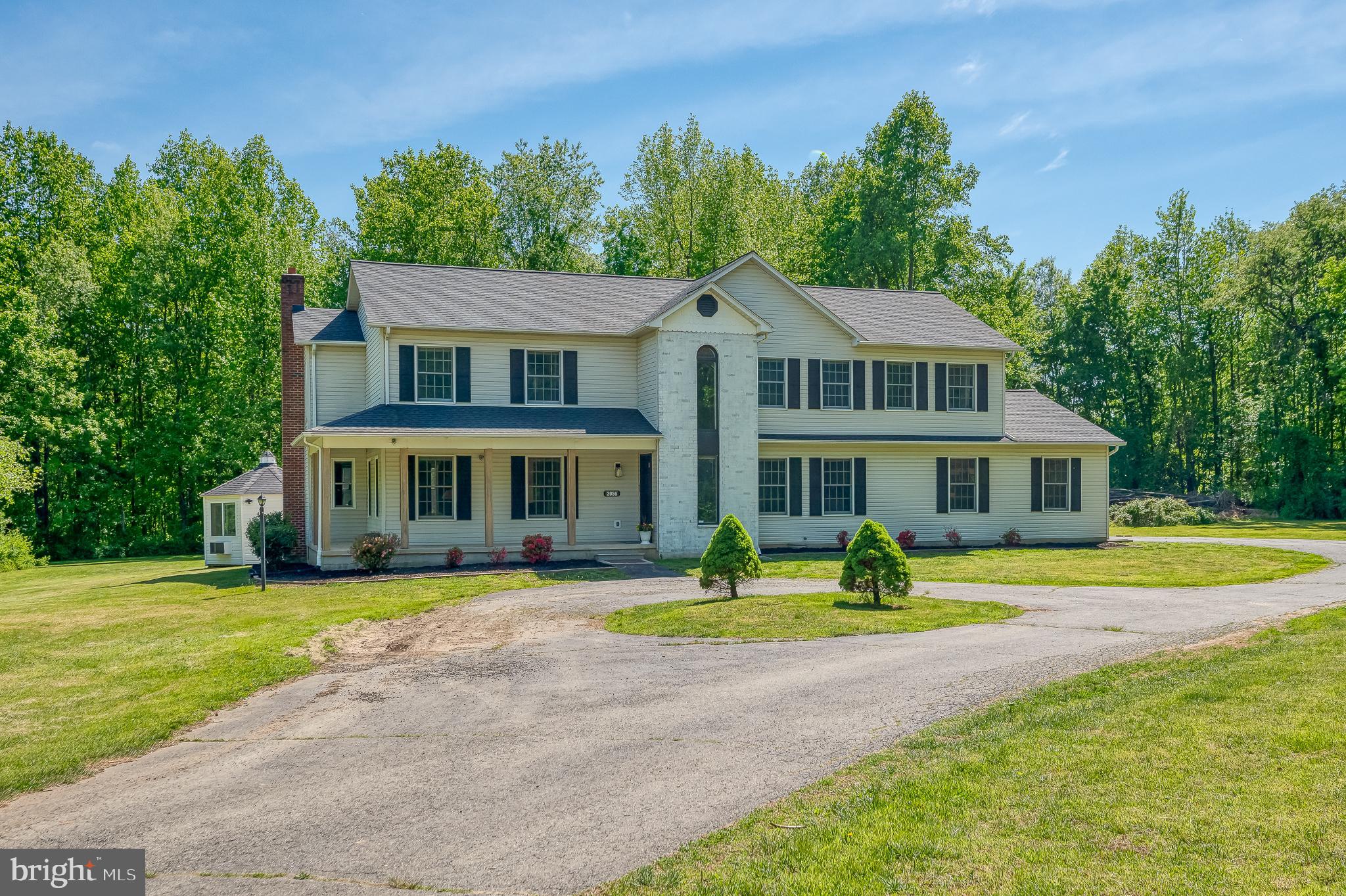 Welcome to 2056 Chapel Rd in Havre de Grace - a private, secluded property situated on approximately 4.6 acres with AG zoning that permits horses. Completely renovated, this spacious colonial offers more than 4,000 square feet of living space with 4 bedrooms and 2.5 baths. It features include a large eat-in kitchen with custom cabinetry, Quartz counters, center island, breakfast area, pot filler and laundry/quartz drop zone (an extension of the kitchen) just steps away. Sliding doors lead to a huge (2026) deck with finished office / gazebo overlooking the wooded setting. You'll find a custom chicken coop and plenty of recreational space. Upstairs, the primary suite includes an oversized walk-in closet and private bath with porcelain tiles, soaking tub, bluetooth mirror and walk-in shower. There are three more spacious bedrooms and a renovated hall bath. The basement is finished with 100-inch TV/theater room with surround sound along with a rec room. Additional highlights include two-zone heating, hardwood floors, custom balusters, all new hardware and fixtures, LED recessed lighting, loft, fireplaces (electric) circular driveway, attached side-entry garage, and generous living space. Conveniently located with a peaceful rural feel while remaining close to I-95, APG, shopping, and dining.