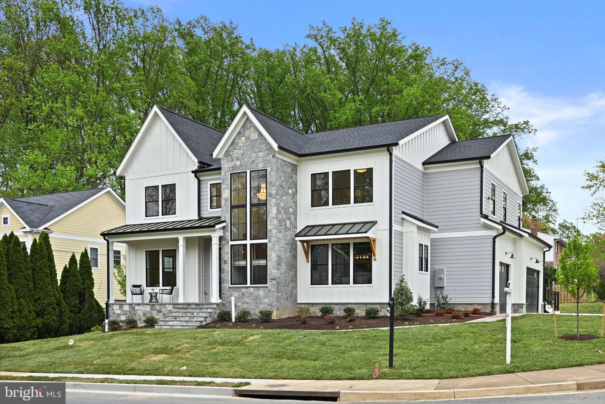 **Price Improvement**Welcome to Vienna Development Alliance's latest offering, a rare combination of an idyllic location, expansive space (including five upper level bedrooms), and an ultra high-end spec level.  Situated on a quiet cul de sac with a side-load three car garage, this Modern Farmhouse will dazzle with its dramatic front staircase clad with natural stone veneer on the exterior and flanked by a wall of windows.  The kitchen features a full Wolf/Sub-Zero appliance package, stacked shaker cabinets with custom hood, quartz countertops with matching backsplash, a cast iron Kohler farmhouse sink, and a massive 10' island.  The entire main and upper levels (excluding tile areas) are covered with 5" wide white oak floors exquisitely finished on site with water-based top coats.  Off the expansive family room is a fully outfitted screened deck, which includes a gas fireplace, as well as an open deck with grilling area.  The oversized mudroom has its own entrance just off the driveway and includes a highly functional custom built-in storage center.  Shiplap accents, ceiling effects, wainscoting detail, and elaborate built-ins are sprinkled throughout the house.  Upstairs, the four secondary bedrooms all include en-suite bathrooms and the laundry/craft room is overloaded with cabinetry and counter space.  The master suite is a true oasis with a sun-filled sitting area perched above the backyard, oversized sleeping quarters, fully built-in walk-in closets, one of which includes a center island, and a spa-like master bath.  The basement offers plenty of space to stretch out with a luxurious feel provided by the LVP flooring over a fully leveled slab.  Enjoy movies and the big games in the massive rec room with a full wet bar and game area.  A bedroom, full bath, media room, and exercise room round out the lower level.  All this in a fantastic NE location that's a half mile walk to the highly rated Wolftrap Elementary as well as Historic Church Street.  Don't miss out!
