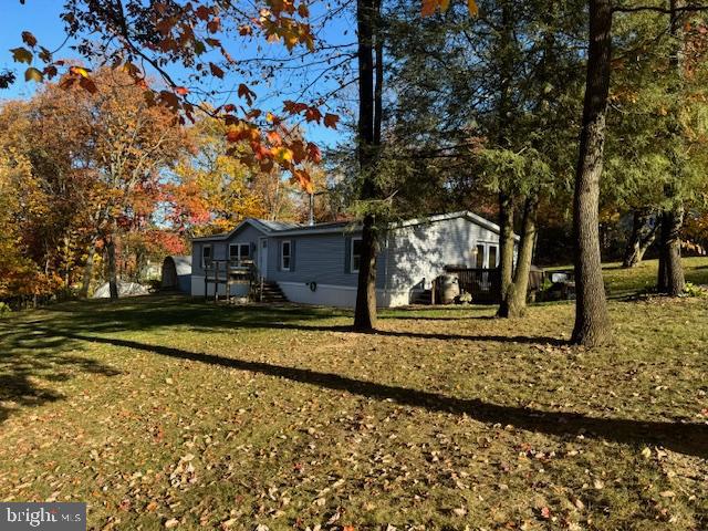 Clean & cozy describes this 1996 manufactured home on .74 acres in Blue Mountain Heights. 1,960 sq. ft. living area. Kitchen/Dining Room combo, tile backsplash. Living Room w/fireplace and access to deck. Primary bedroom w/bath. Two additional bedrooms, full bath. Laundry/Mudroom with large sink and outside entrance. 9' ceilings to the peak. Central air, Hot air heat. Simonton replacement windows. This home is in move-in condition featuring a mountain setting. All on .74 acres including the additional parcel # 34-19-0014.021. Blue Mountain Schools. *Lane to the property is private. No Maintenance Agreement.