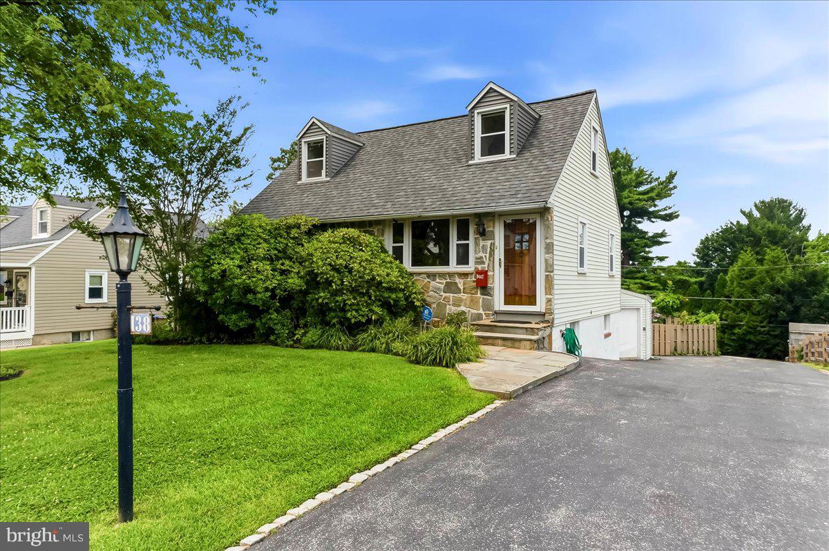 Pride of ownership is evident in this bright & spacious home! If you like to entertain, this home is a must see. Offering upgrades throughout, this 3 bedroom & 2.5 bath Cape Cod in highly desirable Marple Newtown Schools includes warm hardwood floors, 1st floor primary bedroom with 3 closets, a gas fireplace, vaulted ceiling in family room, Bose surround sound, several handmade built-in stained-glass pieces, wine closet with fridge, walk out basement, and so much more. A standout feature of the home is the custom 2 story addition, designed by a local architect and proudly featured in Home Design Magazine, showcasing quality craftsmanship and timeless style. The 2nd floor has a full bathroom, 2 bedrooms, one with a spacious flex space that could be an office, or a walk-in closet. The partially finished basement, accessible by a traditional staircase or the custom designed spiral staircase & level walk out glass sliders, is perfect for hosting & entertaining, complete with a wet bar, several storage closets and workshop space which provides incredible flexibility for hobbyists, creatives, or extra storage. Step outside to your private backyard oasis, featuring a huge 2 tier flagstone patio with hardwired built-in gas grill, cement in-ground pool, mature landscaping, pool shed, handcrafted picnic table and more - ideal for summer gatherings & peaceful relaxation. There are 4 garages in total making this a dream property for craftsman, mechanic, or DIY enthusiasts. The lower, 2 car garage has climate control with heat & AC. From the generous storage to the meticulous upkeep, every detail reflects the care and attention this home has received.  See the Features List and List of Inclusions for additional details.