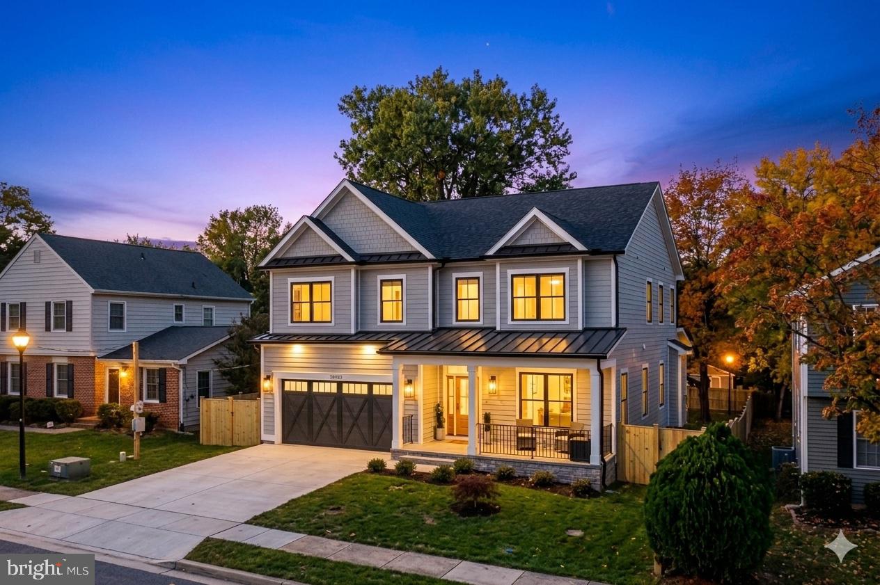 Chef-inspired kitchen, luxurious primary suite, and versatile living spaces designed for modern living.

Built in 2022 by acclaimed ERB Homes, this stunning residence pairs clean-lined modern design with refined, high-end finishes. Beautifully appointed throughout, the home showcases soaring ceilings, custom designer lighting, elegant shiplap accents, and wide-plank blonde hardwood flooring.

Created for both effortless entertaining and everyday living, the expansive open-concept main level offers a seamless connection between formal and casual spaces. At its center, a spectacular great room flows into a chef-inspired kitchen featuring a premium Bertazzoni gas range, stainless steel appliances, a sleek white tile backsplash, and a dramatic waterfall island. A spacious mudroom provides direct access from the garage, while a well-appointed butler’s pantry offers the perfect space for a coffee bar, wine station, or additional storage.

Upstairs, the bedroom level is thoughtfully arranged to provide both comfort and privacy, featuring a private ensuite bedroom and two secondary bedrooms connected by a Jack-and-Jill bath with dual vanities. The luxurious primary suite serves as a private sanctuary, highlighted by a tray ceiling, recessed lighting, a statement chandelier, and three separate walk-in closets offering exceptional storage and organization. The spa-inspired bath features a deep soaking tub, dual vanities, and an oversized glass-enclosed shower with a built-in bench. A dedicated laundry room with a utility sink and folding counter adds everyday convenience.

The fully finished lower level expands the home's versatility with a spacious recreation room, an oversized flex space ideal for a home theater, fitness studio, or playroom, and a private guest suite complete with its own kitchenette—perfect for extended family, overnight guests, or au pair accommodations.

Outside, a covered rear porch overlooks the fully fenced backyard, creating a peaceful setting for outdoor entertaining and relaxation. Professionally landscaped grounds, accented by a stunning Japanese maple, enhance the home's curb appeal and provide a beautiful extension of the living spaces. From its beautifully appointed interiors to its inviting outdoor retreat, this exceptional ERB-built residence offers a rare blend of timeless design, everyday comfort, and elevated living.
