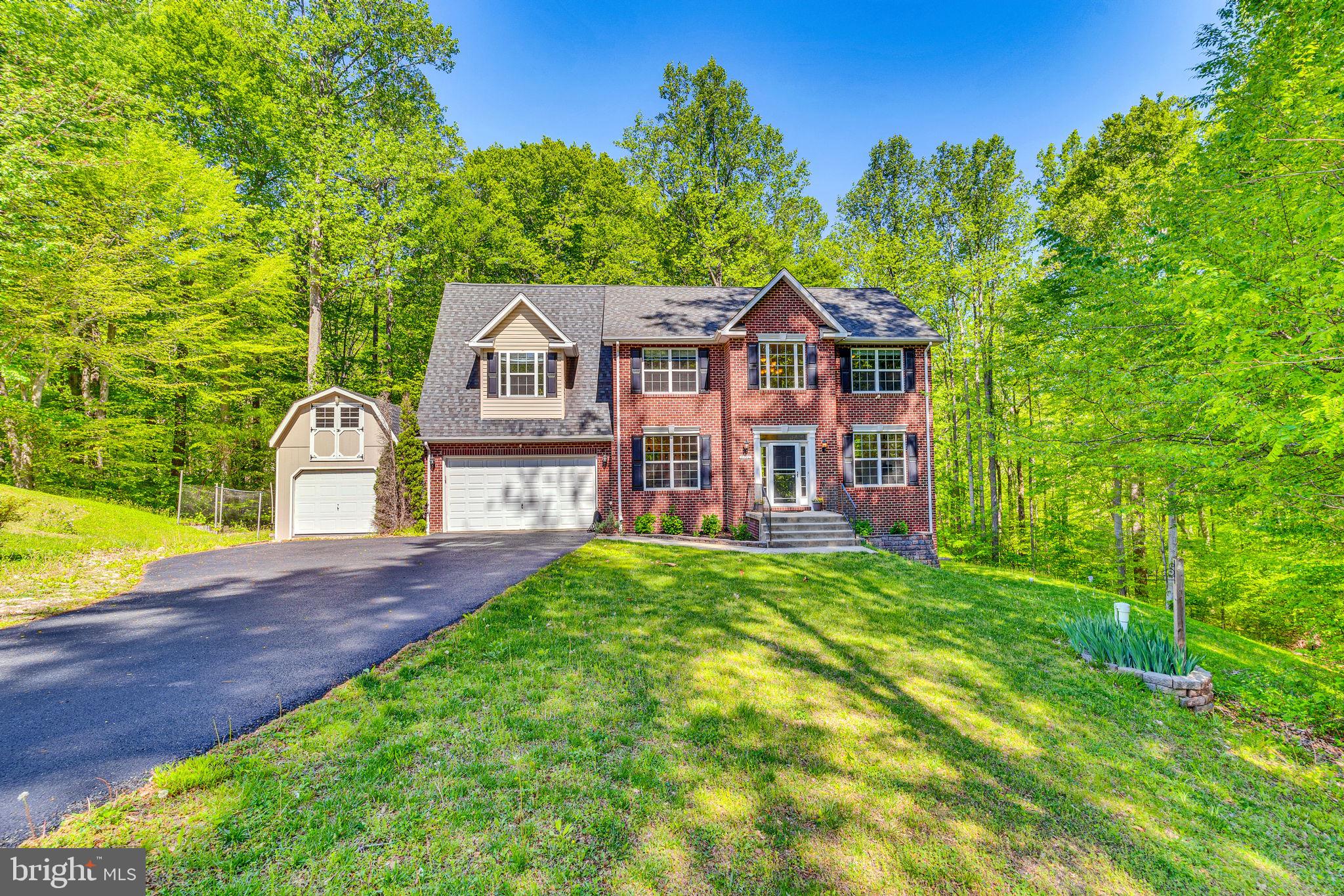 You're going to LOVE 2770 Loving Way!  This fantastic home sits at the end of a quiet cul-de-sac, and offers a ton of peace and lots of living space to stretch out.  The long driveway leads to a welcoming brick front colonial, with a huge detached shed large enough for any hobbyist.  Once inside, you are greeted with an open floor plan, highlighted by a modern kitchen update that will knock your socks off.  Ultra stylish finishes including open shelving, quartz countertops, and two-tone cabinetry set this kitchen apart, and are just begging to host your guests!  The main level also offers a fantastic library workspace with built in shelving and cabinetry, large living and dining spaces, and a huge screened in porch!  Harman pellet stove in the living room as well!  Upstairs, the bedrooms are all generously sized.  The owner's suite is huge, and boasts double walk in-closets a large en-suite bathroom, and even more built-ins for storage!  In the basement, you'll find a flexible walkout space with full bath and a massive pellet stove to help keep the heating bills way down.  This space could easily accommodate multi-generational living or a great guest space.  There is also a paver patio with fire pit right out the basement door!  This home features a new reverse osmosis water filtration system, new HVAC, hardwood flooring, a private lot with tons of space for activities in the back yard, and of course, you'll love the proximity to the Blue Ribbon Schools and commuter routes to JBA, DC, Annapolis, and beyond.  Competitively priced and move in ready, this home is waiting for you!
