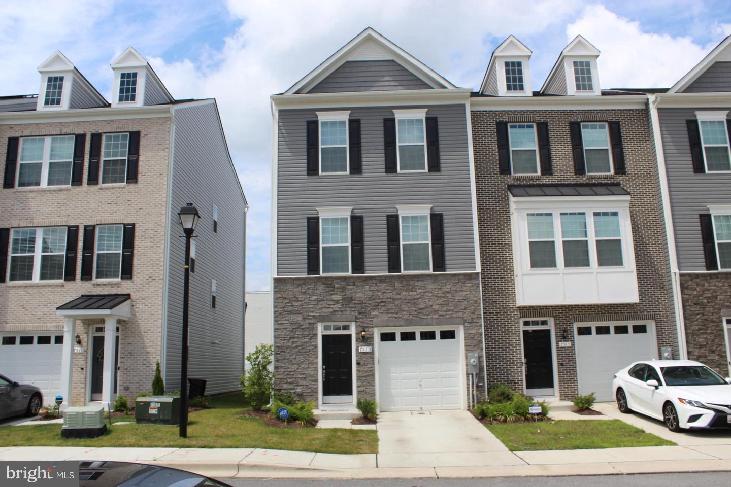 Opportunity to rent a beautiful, newer TownHome! Bright and spacious 3-level unit in the sought-after new community. With thoughtful upgrades, beautiful artistic frames, and beautiful wood flooring throughout.  Ground-level recreation room. Main level features an open floor plan with a dining room, kitchen, and living room combo. Powder room. Spacious kitchen with oversized cabinets, island, and stainless steel appliances. Sliding door off the kitchen leading to a large deck. Upper floor master suite with double walk-in closet, luxury master bath with dual vanities. Laundry room upstairs. 1-car garage. Very convenient location, close to NASA, U. Maryland, and USDA. Minutes to I-495, I-95.