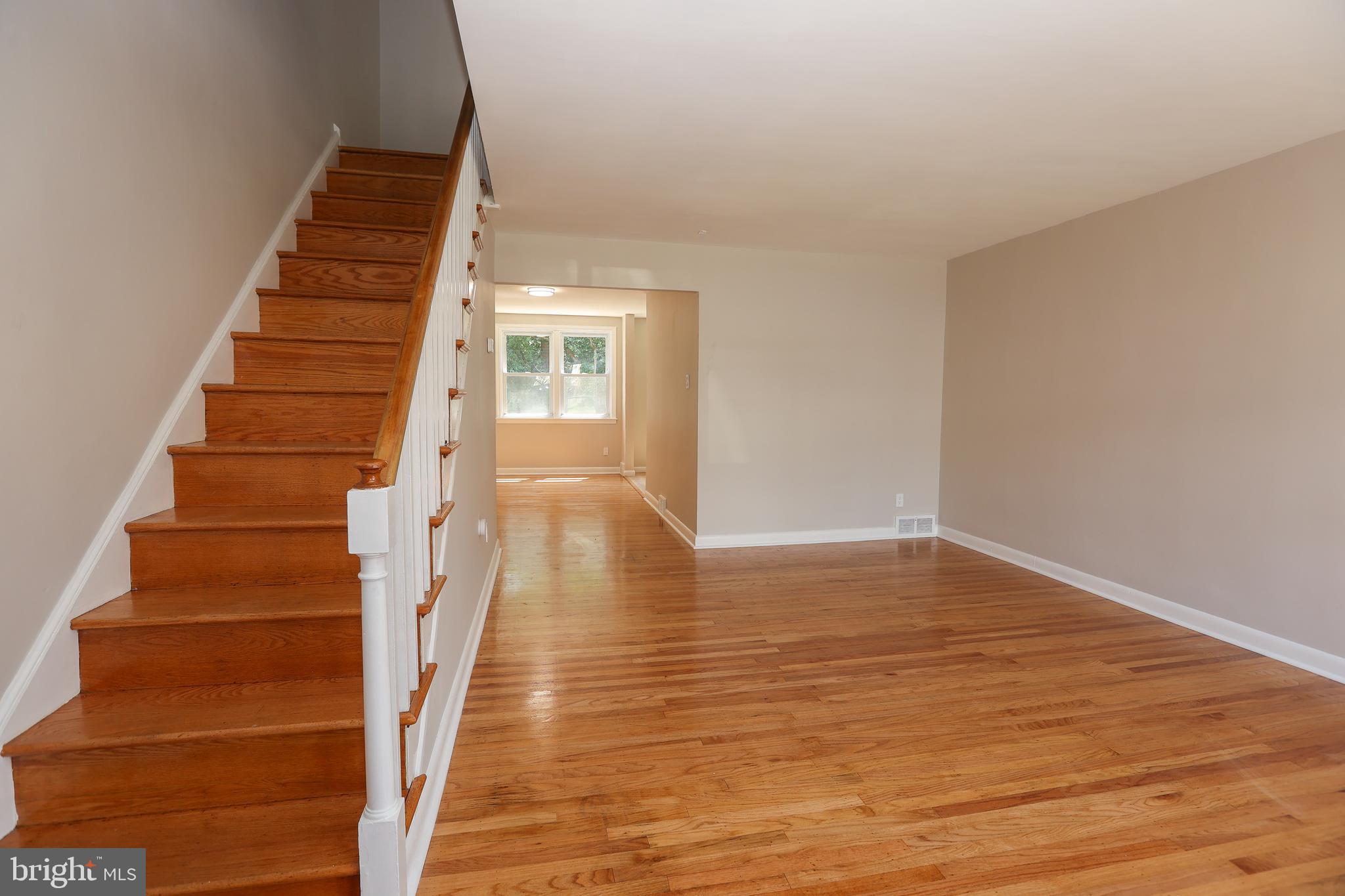 Move-in ready!!  Newly renovated!!    Brand new kitchen with stainless steel appliances.  Beautiful refinished hardwood floors throughout.  Laundry hookups in basement.   Garage with electronic opener.  Driveway parking in the back.  Fenced backyard.  Schedule your showings!  Agent has financial interest.