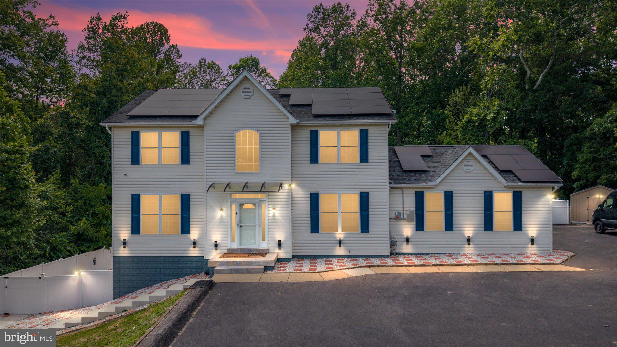 Welcome to this exceptional turnkey estate in the prestigious Fox Field community, where luxury, comfort, and privacy come together on nearly 1.5 acres in desirable Calvert County. This stunning Colonial has undergone an extensive top-to-bottom renovation, offering beautifully updated living space across three fully finished levels. Inside, you’ll find two fully renovated kitchens, five designer bathrooms with marble tile, epoxy flooring throughout, upgraded staircases and railings, a new fireplace, fresh paint, and enhanced basement and garage finishes. The spa-inspired primary suite features a jetted Jacuzzi tub and walk-in closet, while the separate but connected in-law suite/apartment provides ideal flexibility for multi-generational living or guests.

Smart-home and energy-efficient upgrades include newly installed solar panels, a new AC unit, keyless coded entry, camera system, video doorbell, and upgraded interior and exterior lighting. The outdoor space is truly resort-style, featuring a fully renovated in-ground pool with new concrete surround and equipment, custom fencing, pool house improvements, outdoor shower, new shed, regraded landscaping, stonework, and a brand-new asphalt driveway with decorative lighting and parking for up to 15 vehicles. This is a rare opportunity to own a fully updated home where every major improvement has already been completed—just move in and enjoy.