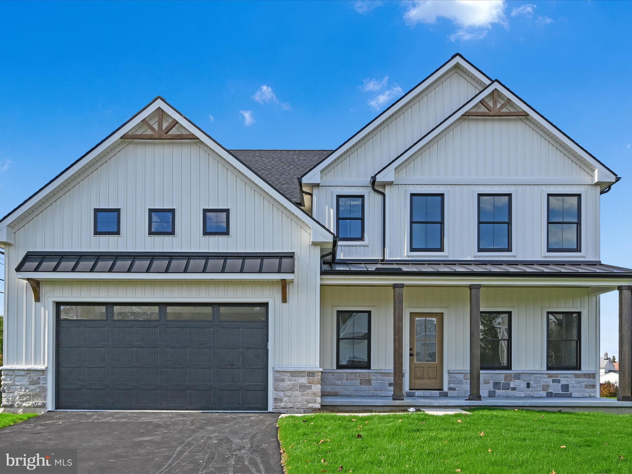 Brand-new construction without the wait — move right in and skip the 6+ month build timeline. Enjoy the best of both worlds with the benefits of new construction, a 1-year builder warranty, and immediate availability. Located in the highly desirable Haydn Manor community in East Hempfield Township, this thoughtfully designed home offers the perfect blend of style, comfort, and convenience. Residents enjoy walking trails, a community park, and easy access to restaurants, shopping, entertainment, and major commuter routes throughout Lancaster County. Offering 2,900+ square feet of living space, this home stands out with quality craftsmanship and high-end finishes throughout. The open-concept main level is filled with natural light and features crown molding, stained wood beams, upgraded LVP flooring, and a spacious layout ideal for everyday living and entertaining. The kitchen is a true showpiece with quartz countertops, premium appliances, custom cabinetry, an oversized island, and a walk-in pantry with built in shelving. A built-in bar adds both style and functionality. The dining area opens seamlessly to the family room, where a gas fireplace creates a warm and inviting focal point. A dedicated office or flex room on the main level offers additional versatility. Upstairs, you’ll find four generously sized bedrooms, three full bathrooms, and a convenient second-floor laundry room. The primary suite features a large walk-in closet with built in shelving, and a beautifully finished bath with a dual vanity and custom tile shower. The unfinished basement offers 9-foot foundation walls, natural gas heat, and endless potential for future living space. Outside, enjoy a private backyard setting while being just minutes from Manheim Township, Lititz, East Petersburg, Lancaster City, Manheim, local hospitals, and the airport. Call today to schedule your private showing!