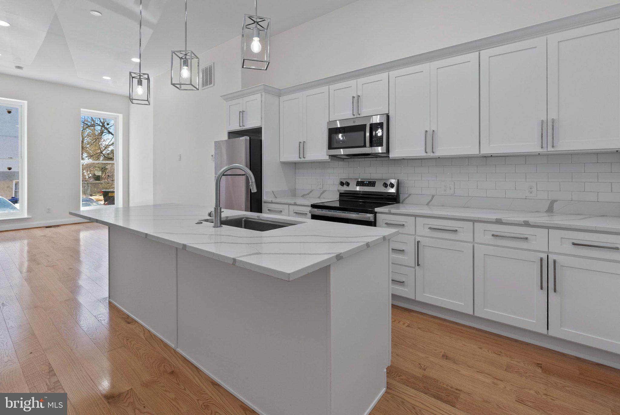 Welcome to elevated city living in the heart of Baltimore! This newly renovated 3-story home with over 2,500 square feet of thoughtfully designed space, featuring 5 spacious bedrooms, 3 full baths, and 1 half bath. From the moment you enter, you’re greeted by large, sunlit rooms, high ceilings, and a beautifully open layout designed for both everyday living and entertaining.
Enjoy luxury finishes throughout, including a modern gourmet kitchen, stylish fixtures, and well-appointed details that bring both comfort and sophistication. The seamless flow of the home extends to a private deck and a fully fenced rear yard—perfect for relaxing or hosting gatherings.

Located in a growing community being revitalized by Parity Homes, this property offers more than just homeownership—it’s an opportunity to be part of something bigger. Experience the perfect blend of quality craftsmanship, community vision, and urban convenience. This home also qualifies for a $20,000 down payment assistance program, making homeownership even more attainable for eligible buyers. This property is one of several homes available. Photos are representative of previously completed homes by the builder. Finishes and layouts may vary.

Come discover what it means to love where you live—welcome to luxury city living redefined.