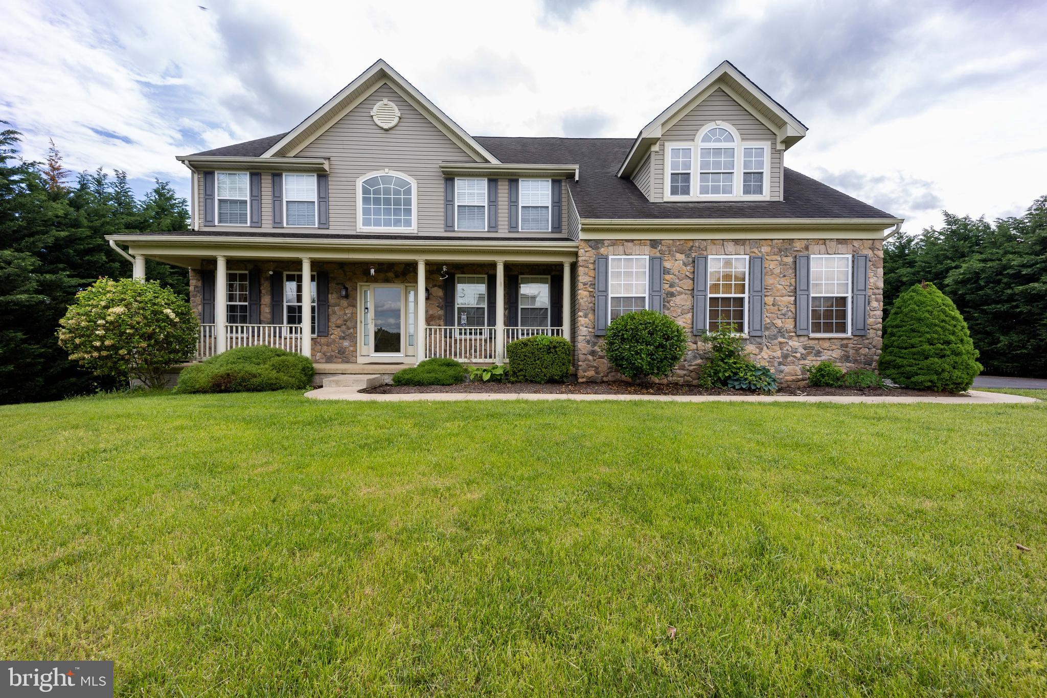 This is a MUST SEE home in the popular Apple Knolls Estates and Hedgesville Middle/High School district.  This colonial boosts over 5200 sq ft of living space spanning 3 levels.  Grand Foyer Entrance. Formal Living & Dining spaces both with Bay Windows. Office space with French doors and shelving. Open concept Kitchen/Sunroom/sunken Family Room. Kitchen offers lots of counter space w/ an island and breakfast bar. Sunken Family Room has shelving and a pellet stove. Sliding doors w/ built in blinds from sunroom to deck w/ a privacy screen and Sunshade.  Upstairs offers 5 bedrooms. Primary Suite has a sitting room w/ double walk-in closets. Separate walk-in closet that is a dream come true w/ granite countertops, multiple built-ins, vanity, jewelry drawers, shoe cubbies, double hanging clothing rods, and more. Primary bath has a soaking tub, separate shower, and dual vanity. TV and mount convey in Primary Bedroom and Bedroom 2. Bedrooms 3 & 4 have a Jack & Jill bathroom. Bedroom 5 has entrance to full bath that is also accessible from the hall way. Fully finished basement has walk-out stairs w/ chairlift.  Exercise room features foam flooring. Great Room has a kitchenette/wet bar w/ granite counter top. TV and mount convey. Plus another multipurpose room and full bath.  House is completely wired for central internet and generator ready. New Gas Water Heater 2019. 500 gallon propane tank conveys (owned). Home has an attached oversized 2 car garage and a detached 2 car garage for lots of parking, storage, workshop space, etc. Custom blinds and other window treatments convey. CAMERAS ON SITE - Ring Doorbell and several cameras inside and outside - THESE DO NOT CONVEY. Propane tanks in the detached garage DO NOT CONVEY - owner will remove prior to closing.
