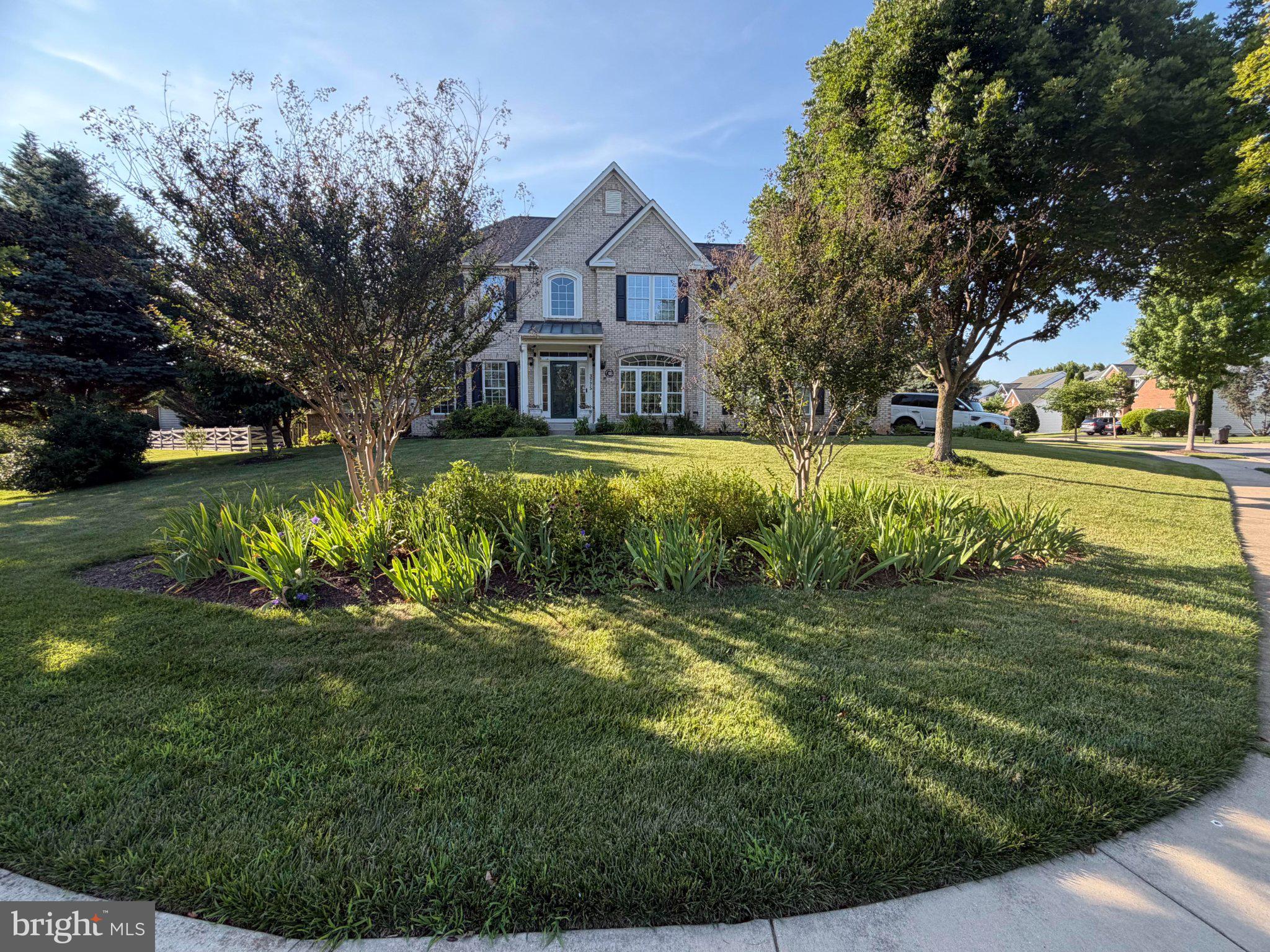 Discover an exquisite blend of elegance and comfort in this stunning colonial style home located on a manicured corner lot, nestled in the prestigious Villages of Urbana. Spanning over 5,000 sq ft., this charming Waverly Model built by Ryan Homes invites you into a two story foyer boasting a beautifully curved staircase, and an exquisite main level featuring an executive office, formal living/dining room with an adjacent sunroom, a gourmet kitchen with large island, and a rear morning room that seamlessly flows into the cathedral family room, perfect for cozy gatherings in front of the fireplace. The rear stairs off the family room is a convenient escape to the 4 spacious bedrooms on the upper level, featuring a primary suite with a large sitting area, walk-in closets, and a spa-like bathroom with a soaking tub and walk-in shower.  Ideal for entertaining family and friends, this luxury home has a fully finished lower level with a theater room, gym, a large recreation area, and a full bath.  Now is the time to upgrade, don’t miss this opportunity to elevate your living experience!