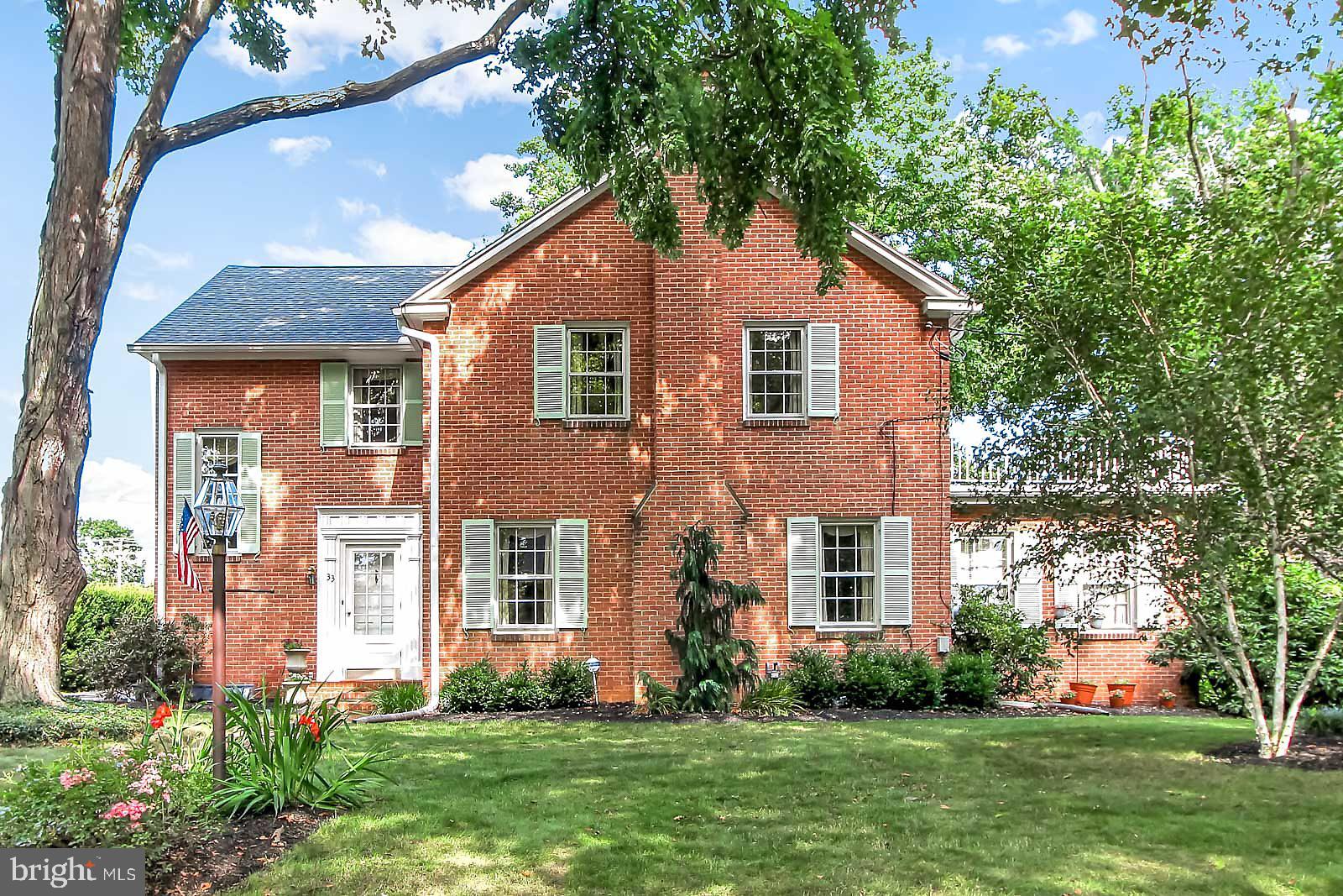 STATELY BRICK 2 STORY COLONIAL,  "WILLIAMSBURG VIRGINIA STYLE HOME".  Conveniently located in "OLD EAST YORK" ELEGANTLY APPOINTED THRU OUT! *PERFECT for entertaining!.  *LARGE REMODELED KITCHEN  w ABUNDANT cabinetry and counter space, *FORMAL DINING ROOM w chair railings and crown moldings and wood floors.  FIRST floor sun porch w glass sliders overlooking a water falls, *STUNNING FORMAL LIVING ROOM w 6 on 6 windows, GAS FIREPLACE AND wood floors.  FIRST floor "LIBRARY" or DEN"  with built in BOOKCASES.  Open staircase leads to a 2nd floor sitting area, 3 large bedrooms, MASTER BEDROOM AND MASTER BATH, tile and wood floors. SECOND floor large terrace w iron railings perfect for casual evenings!  Lower level Family Room and storage, laundry, workshop.  Detached brick 2 car garage w side door entry.  THIS home is on a beautifully "manicured lot" located on a very impressive street, minutes to I 83, and Rt 30.