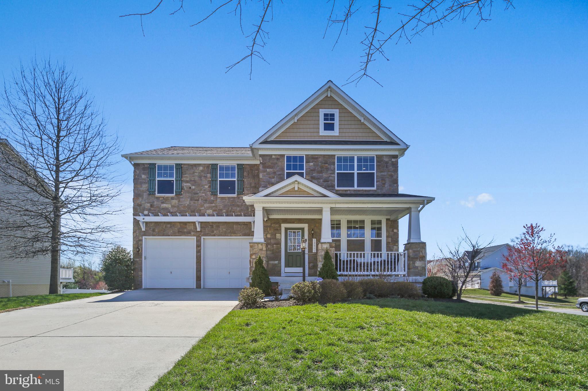 Located on a prime corner lot, beautifully maintained and thoughtfully upgraded, this 5-bedroom, 3.5-bathroom home in the highly sought-after Dixon Crossing offers an exceptional blend of space, style, and updates.

From the moment you arrive, you'll be captivated by the home's stone front and charming front porch, perfect for relaxing and enjoying the neighborhood. Step inside to find an inviting open-concept layout with gleaming hardwood floors and abundant natural light.

The gourmet kitchen is a chef’s dream, featuring sleek black quartz countertops, a stylish tile backsplash, stainless steel appliances, and ample cabinetry for storage. A spacious family room with a cozy fireplace flows seamlessly from the kitchen, making it ideal for gatherings.

The 6-foot bump-out on all three levels expands the living space, enhancing the family room, the luxurious primary suite, generously sized second bedroom, and lower level. The primary suite boasts a spa-like en-suite bathroom with a soaking tub, separate shower, dual vanities, and a huge (15' X 10') walk-in closet.

The lower level with walk up stairs to rear yard offers incredible versatility, featuring a 5th bedroom (w/ egress), a full bathroom, a spacious recreation area, and ample storage.

Other recent updates include a new roof (2023), paint, carpet, and lighting on the main and upper levels (2023), basement paint, carpet, and lighting (2021), and a new AC system (2021).

Ideally located near shopping, dining, and major commuter routes, this home is a true gem in an unbeatable location. Don’t miss this incredible opportunity!