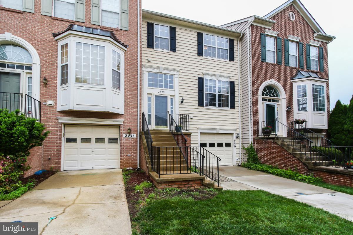 WELCOME HOME TO THIS STUNNING TOWNHOUSE FEATURING 3 BEDROOMS, 2 FULL BATHS AND 2 HALF BATHS. GLEAMING HW FLOORS. OPEN FLOOR PLAN WITH GORGEOUS UPDATED KITCHEN, SS APPLIANCES , CABINETS AND GRANITE COUNTER TOPS LEADING TO PRIVATE DECK. FULLY RENOVATED BATHS.   FRESH PAINT AND CARPET.  SPACIOUS LOWER LEVEL FR WITH WALK OUT TO PRIVATE STONE PATIO. ATTACHED GARAGE.  A MUST SEE!!