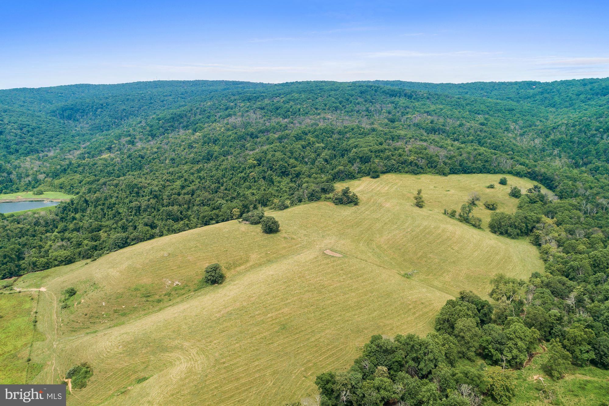 Fleetwood Farm - East showcases the rolling hills and majestic mountain views that Virginia's Hunt Country is known for. Comprised of 9 parcels totaling 1,150+/- acres of mature farmland, this massive plot sits a mere 60 miles west of Washington DC. On the property is 1 tenant house. Access to Gap Run, streams, and a pond. Located a stone's throw from Sky Meadows State Park and multiple country towns, there are ample trails and local activities to enjoy. Access to the property is a snap with road frontage that includes Carr Ln and Route 17. This is a phenomenal investment opportunity! Not in conservation easement.