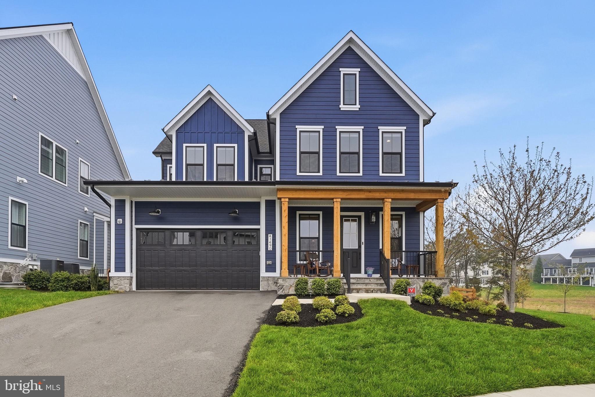 Luxury living meets modern functionality in the highly desired Hartland’s Community.  
Welcome to this stunning Grandin III Contemporary Farmhouse style home by Van Metre, where sophisticated design meets everyday comfort. This home is loaded with premium upgrades, including high-end flooring throughout, extra windows and soaring 10-foot ceilings that amplify the natural light. Designed for the modern professional, the main level features a private office with a stylish barn door, ideal for a work from home sanctuary. The open concept living area flows seamlessly into the great room, anchored by a cozy gas fireplace flanked by windows. The gourmet chef’s kitchen is a true showpiece, boasting custom style cabinetry, an oversized center island, double wall ovens, a walk-in pantry, and an upgraded appliance package. A large mudroom with custom built-ins ensures effortless organization. Escape to the private primary suite, complete with an expansive walk-in closet and a spa like bath featuring the free standing soaking tub, dual vanities and an oversized walk-in shower. Three additional spacious bedrooms, two more full baths, and a dedicated laundry room with built-in cabinetry complete the upper floor.  The finished walk up lower level is an entertainer's dream, featuring a spacious recreation room, a 5th bedroom, a 3rd full bath, and a dedicated exercise room. Step outside to your private oasis: a newly fenced backyard equipped with a professional irrigation system and custom landscaping.
This home is nestled in the prestigious Hartland community, enjoy world class amenities including a clubhouse with a great room, fitness center, playroom, and locker rooms, as well as a competition sized pool. The area also has a playground and multi use sports courts to include tennis, basketball, and pickle ball. Call today for a private tour!