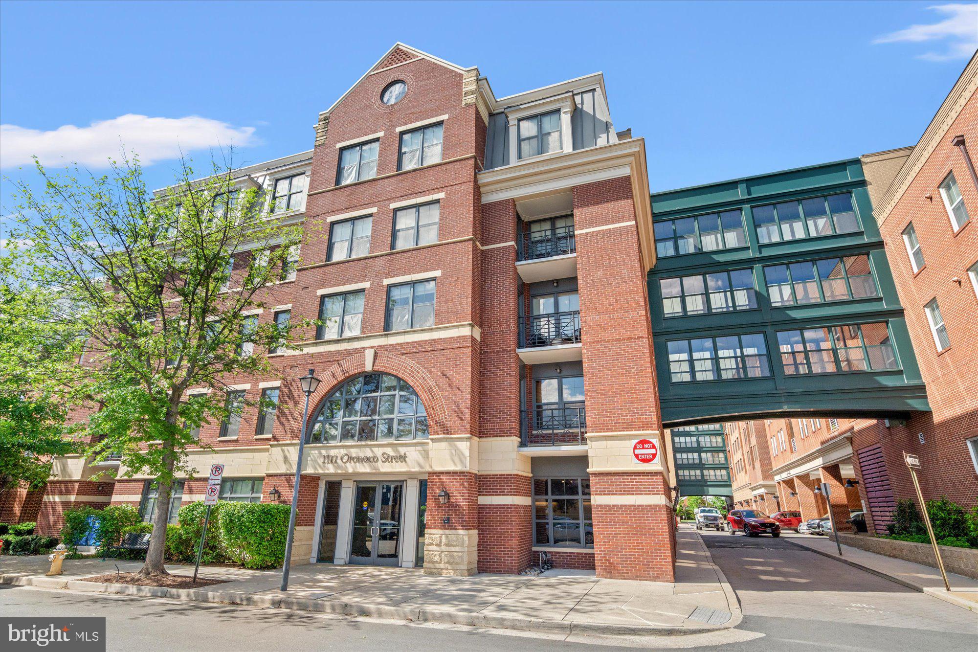 Spacious 2BR, 2BA unit with 2 parking garage spaces in The Henry, one of Old Town Alexandria's premier luxury condo developments. Enjoy this stylish, modern and amenity rich mid-rise 6 story building in the historic Parker-Grey neighborhood, only 2 blocks from the Braddock Rd metro and a short walk from the vibrant Old Town waterfront district.  The Henry offers an easy, convenient lifestyle with a concierge, front desk services, party/library room,  business center, 24-hr gym and amazing views from the rooftop terrace.  Unit #441 is freshly painted, move-in ready,  1,158 sqft sun filled interior space. Great floorplan with large hallway, open kitchen and breakfast bar, bedrooms are nicely separated  on the opposite sides of the unit, plenty storage, washer and dryer in the unit. Secure parking garage, 2 parking spaces next to each other and separate storage unit. Welcome home!