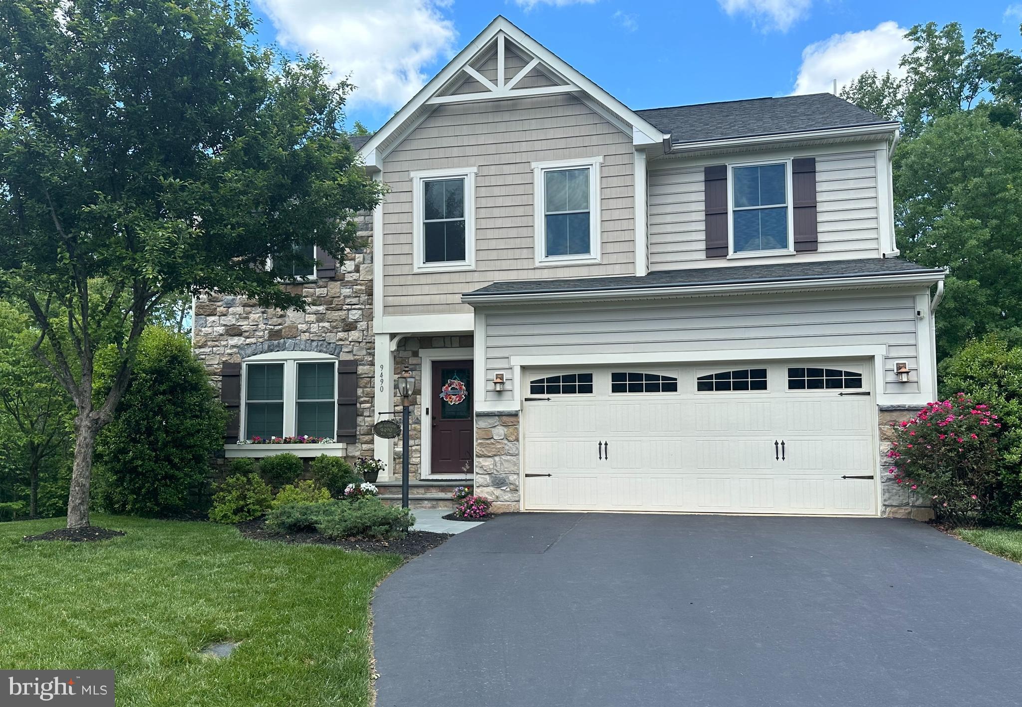 ABSOLUTELY BEAUTIFUL HOME!  Over 4250 finished sq feet. Featuring custom stone entry walkway. Formal living and dining rooms with crown and chair moldings.  HUGE kitchen with 42" cabinets, granite counters, SS appliances, large island with breakfast bar, and walk-in pantry.  Sunroom with new Pella French door. OPEN concept to the family room with custom stone fireplace.  Main level office with built-ins.  Half bath.  Hardwood floors throughout the main AND upper levels.  AMAZING primary suite with 2 walk-in closets.  Primary bath renovation with free standing tub, custom vanity and designer tile and wall accents.   Upper level also offers additional family room/play area and laundry room.  Additional 3 bedrooms, one with a private bath and an additional full hall bath for the other two.  The walk-out lower level offers a SPACIOUS rec-room with multiple entertaining areas, full bath and a gym/craft room with French doors.  Large storage area for all the extras, don't need that much storage?  finish it for a 5th legal bedroom. Entertain outside on the low maintenance composite deck overlooking the fenced yard and mature trees.  OR cozy up on the patio around the firepit.  Lawn sprinklers, EV charger, gutter guards, this home has it all.  New  front windows. HVAC 2020 -- too much to list it all.